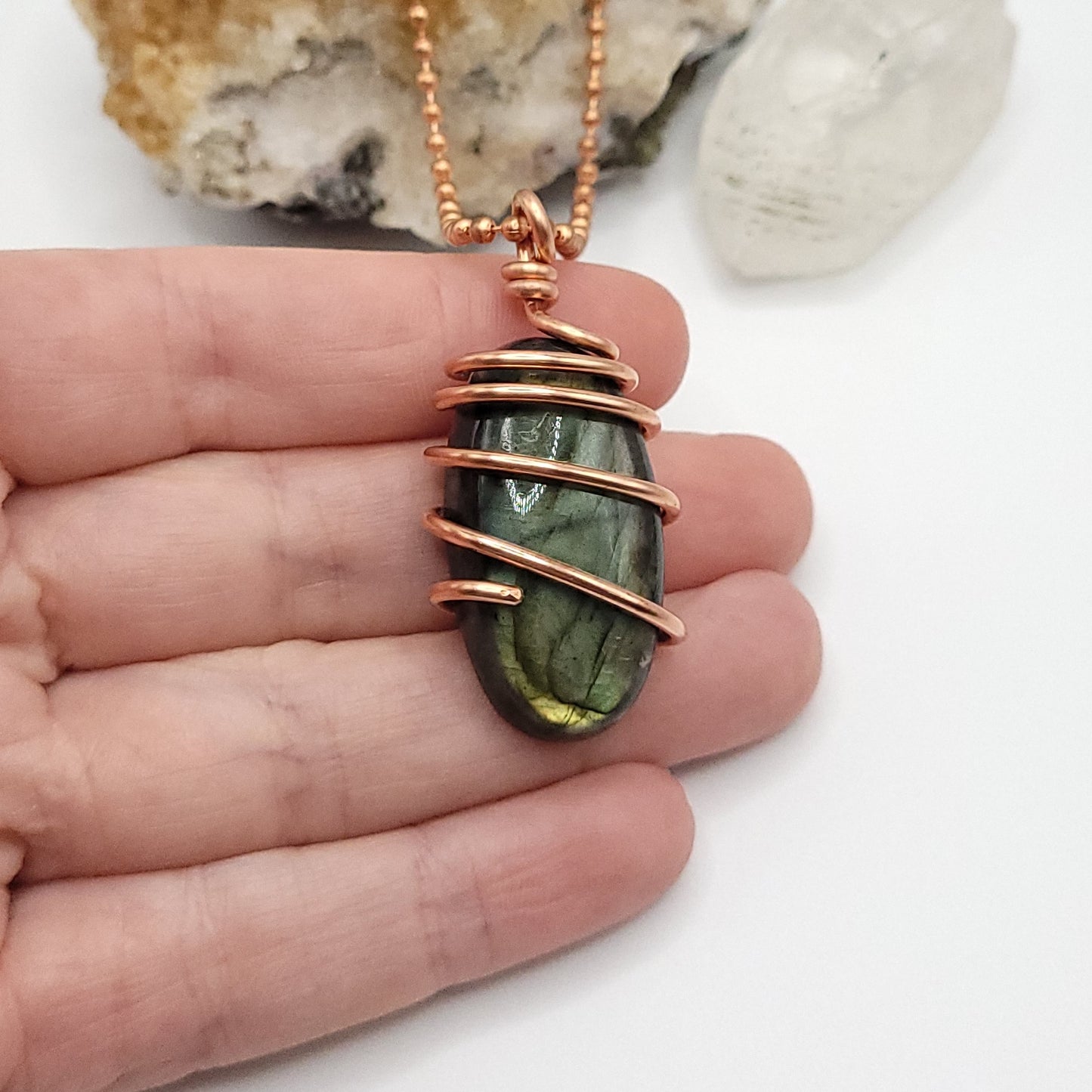 labradorite necklace in copper in hand