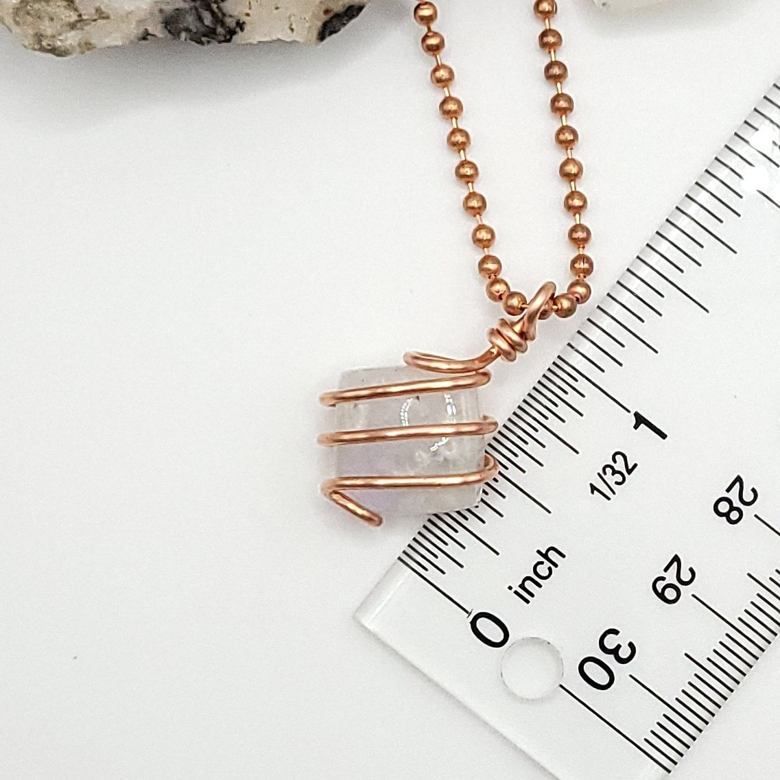 rainbow moonstone necklace in copper next to ruler measures just over 1 inch