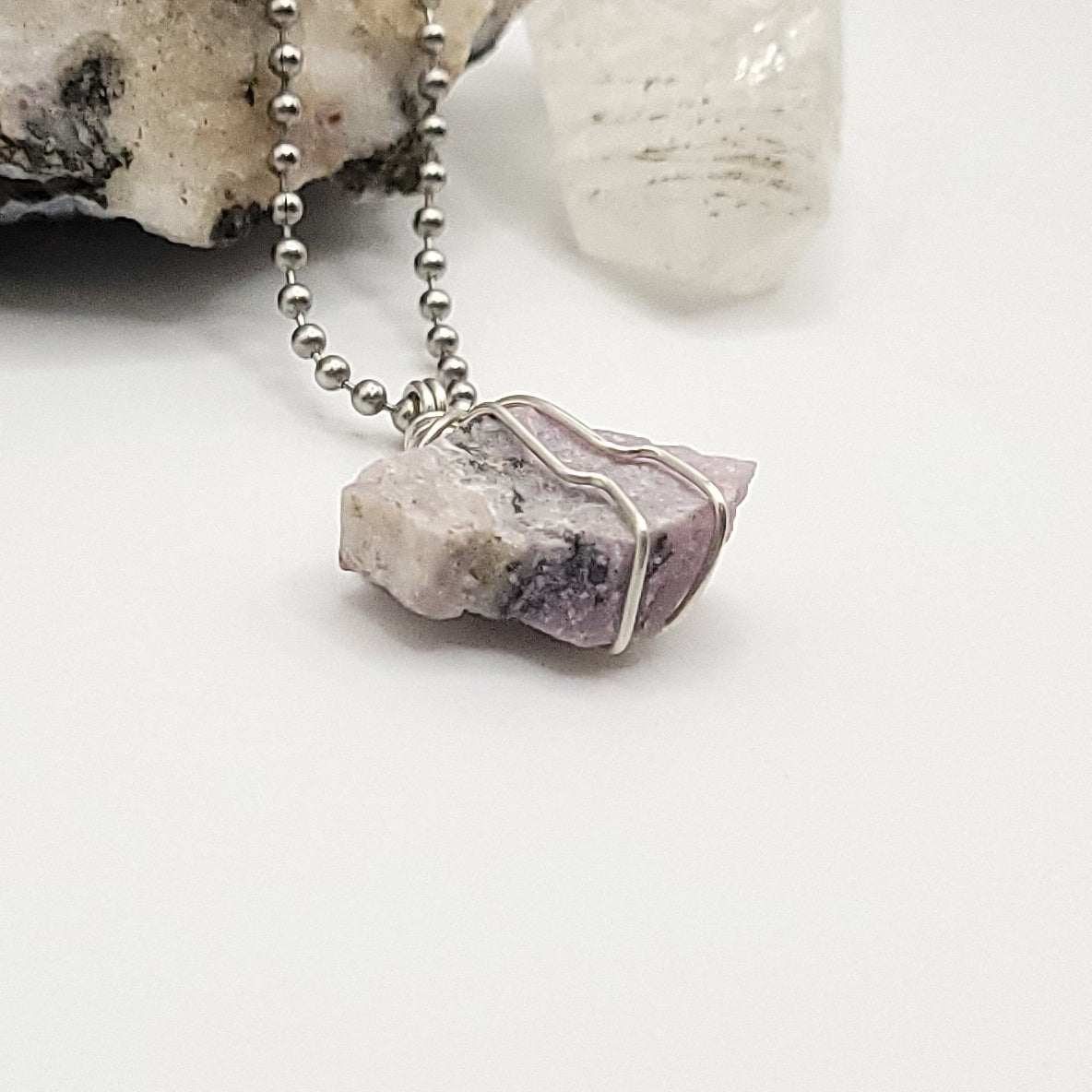 raw pink moonstone necklace in silver side view