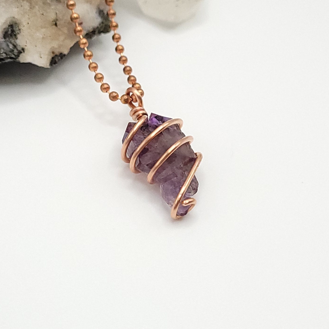 raw amethyst necklace in copper side view