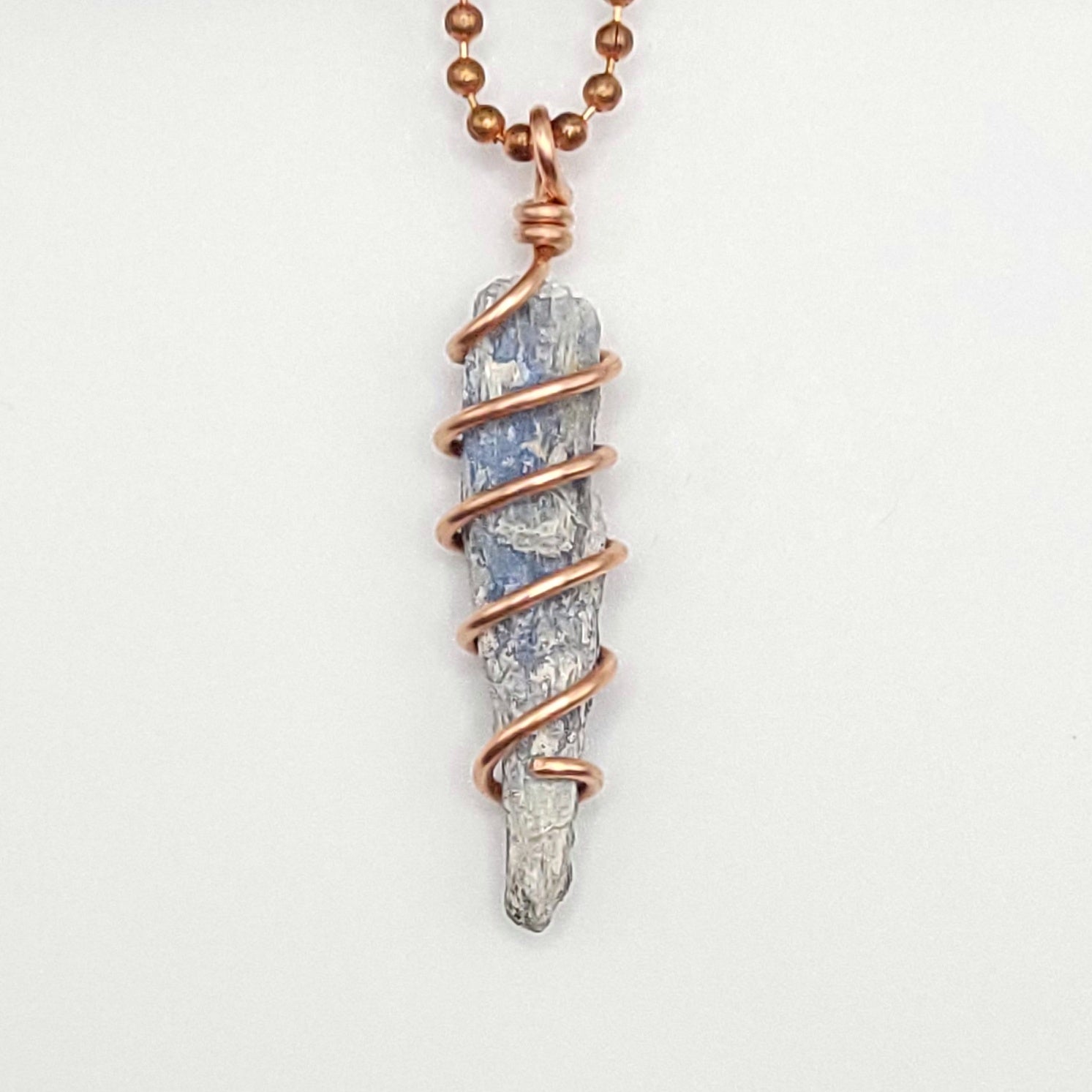 raw blue kyanite necklace in copper close up