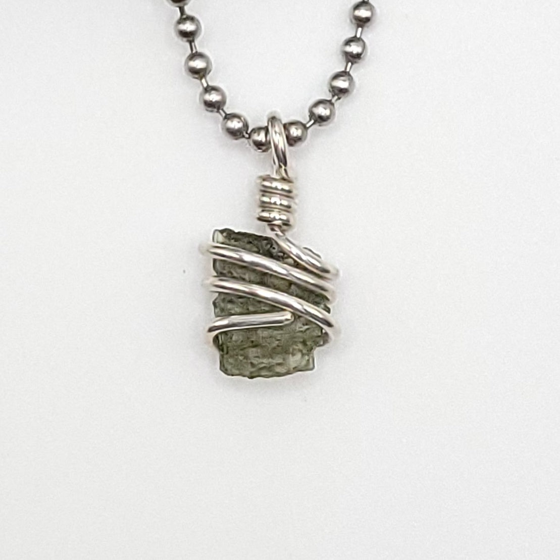 Raw Moldavite Crystal Necklace in Silver, close up