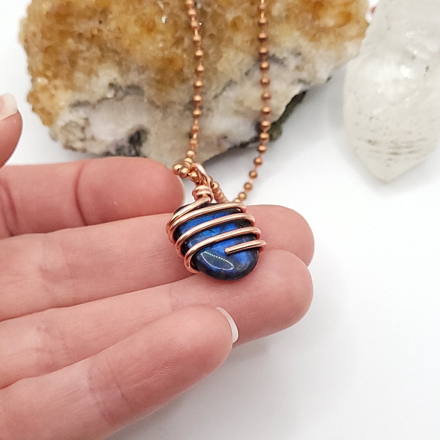 labradorite necklace in copper in hand