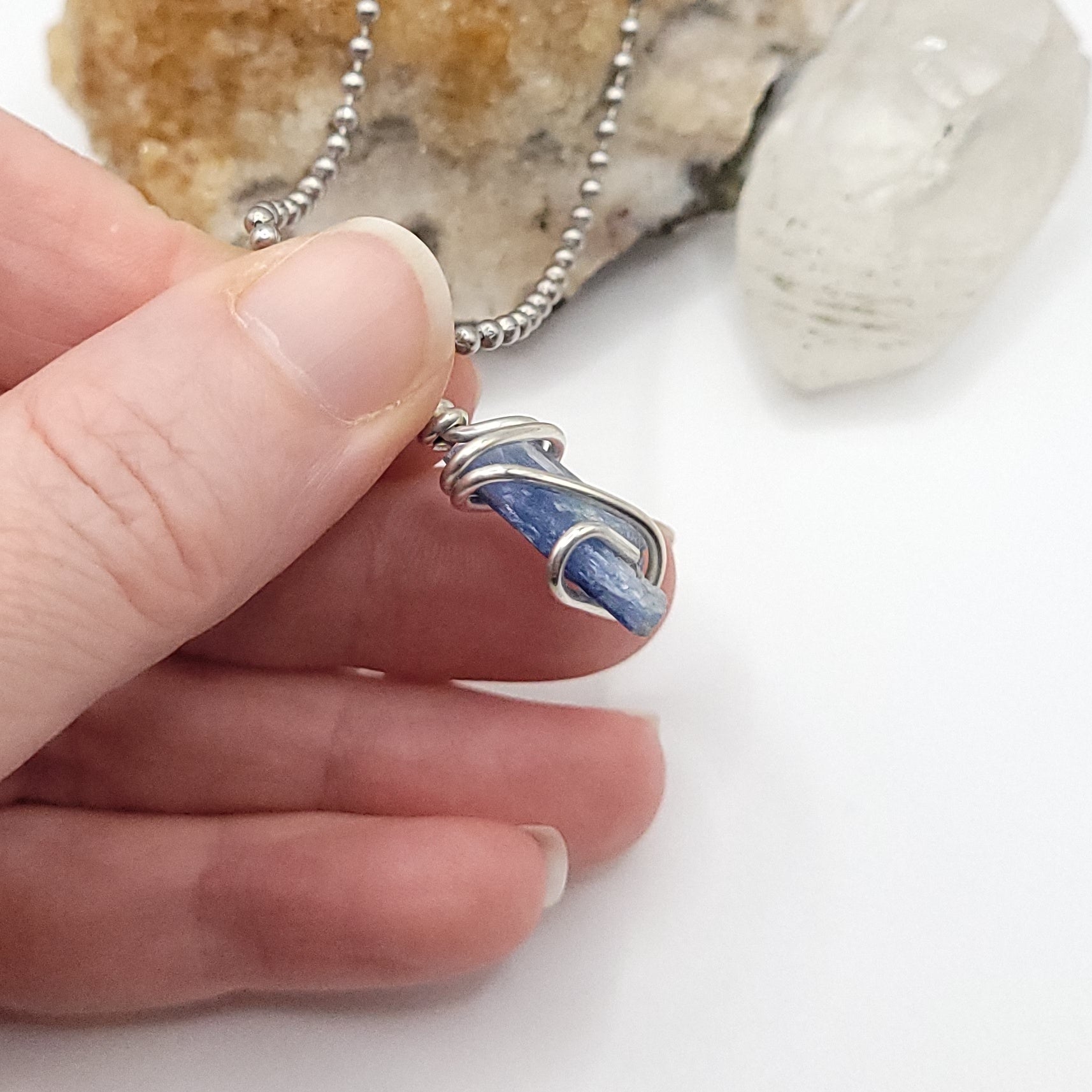 raw blue kyanite necklace in silver wire side view