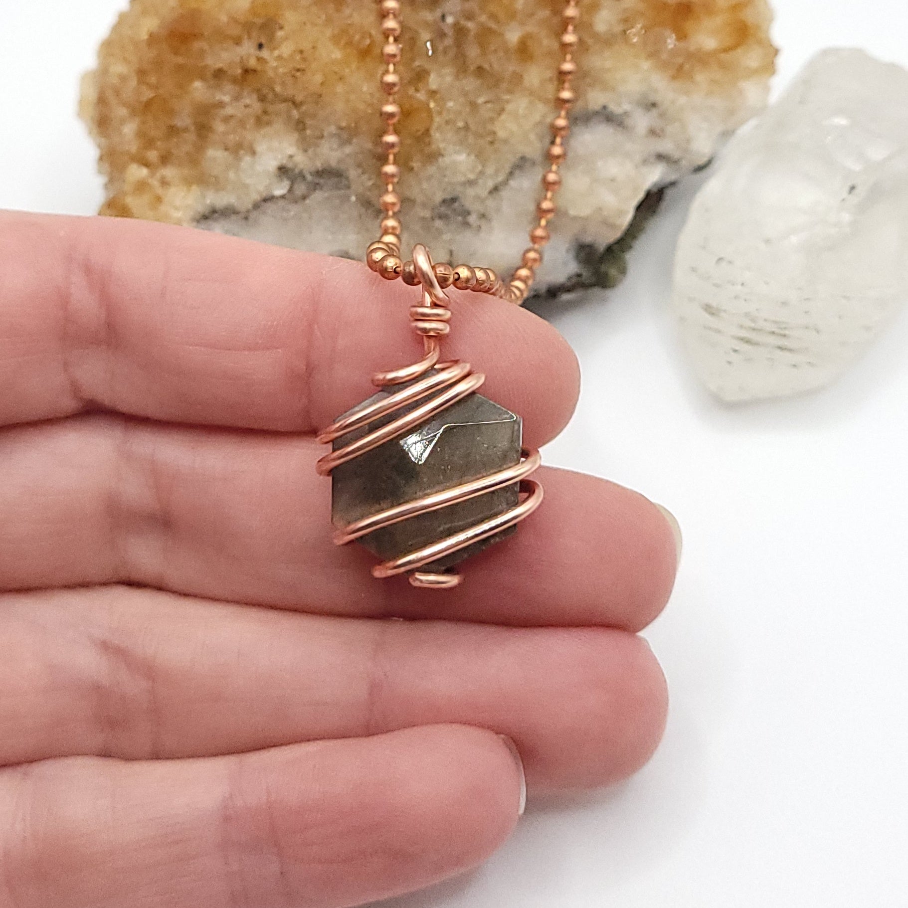 hexagon labradorite necklace in copper in hand