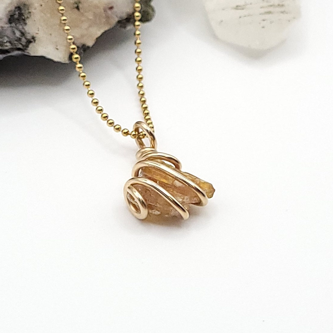 Raw Orange Kyanite Crystal Necklace in Gold, side view