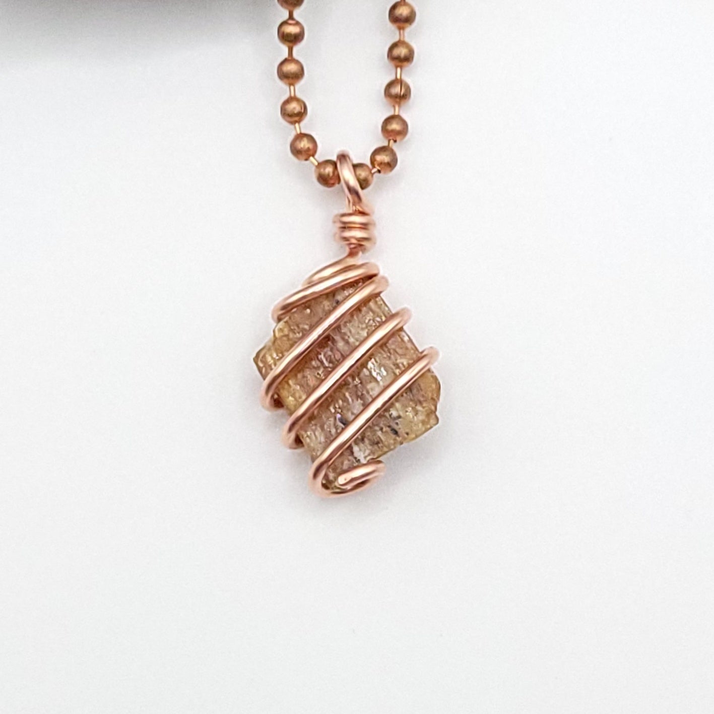 Raw Orange Kyanite Crystal Necklace in Copper, close up