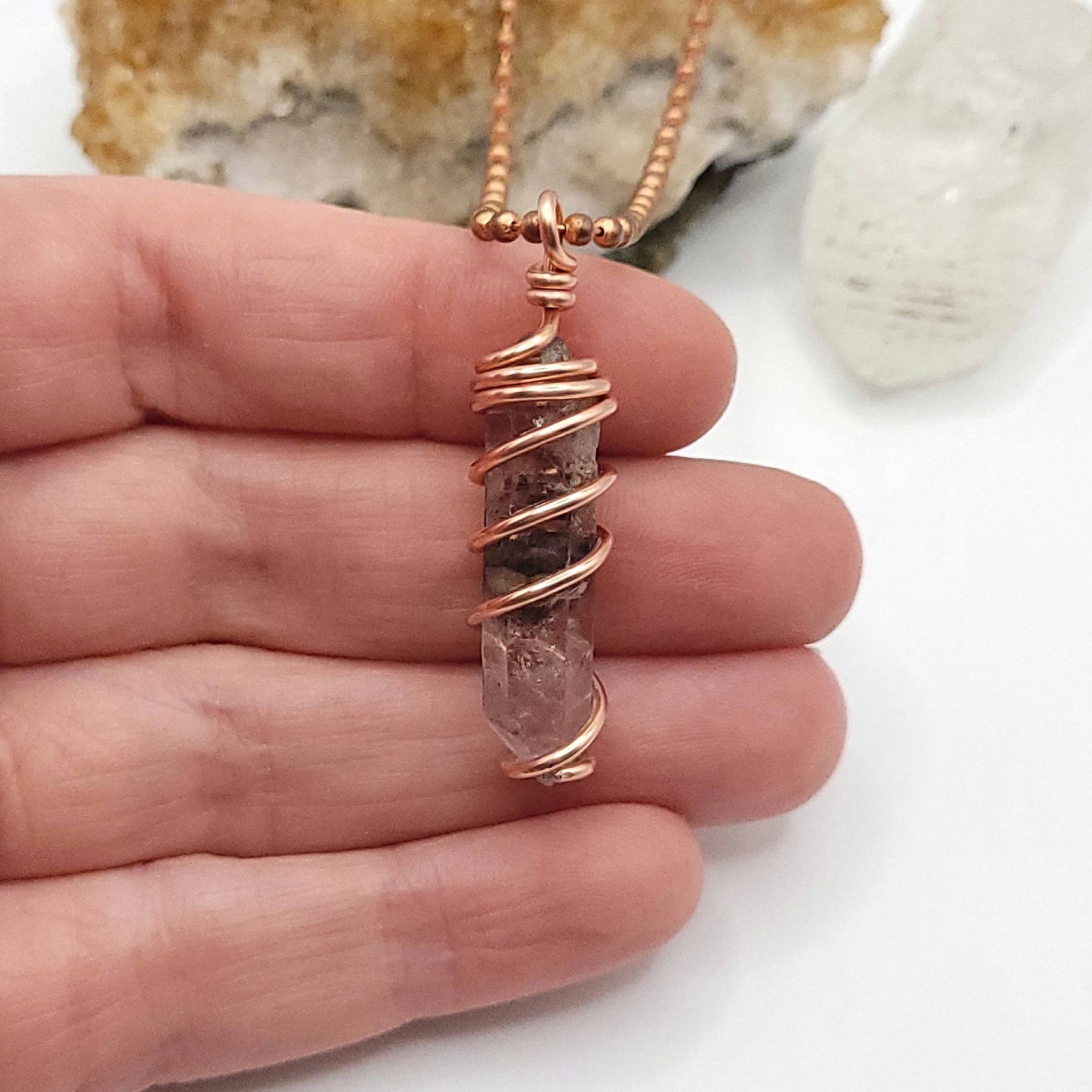 tibetan quartz necklace in hand