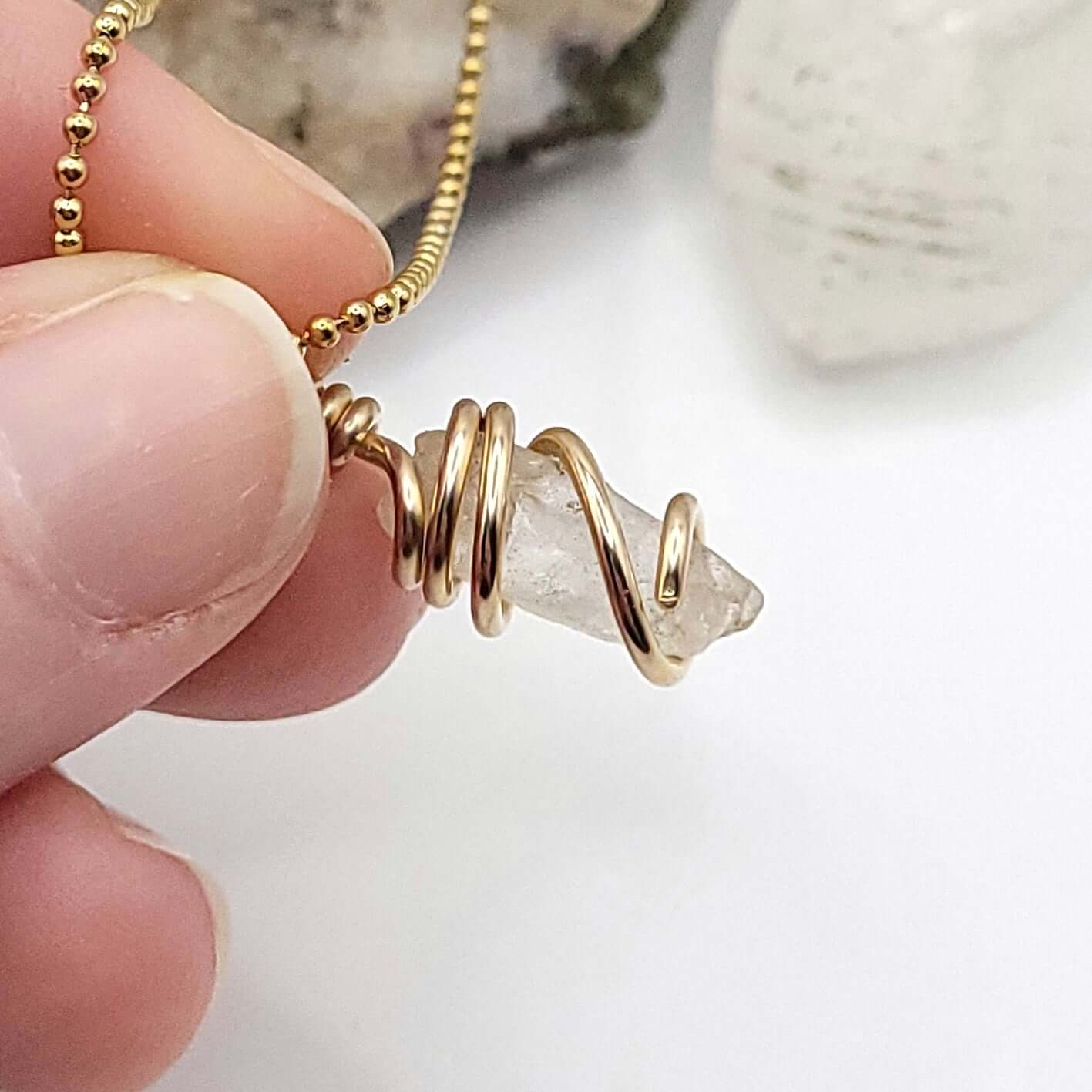 Raw Phenakite Crystal Necklace in Gold, white background