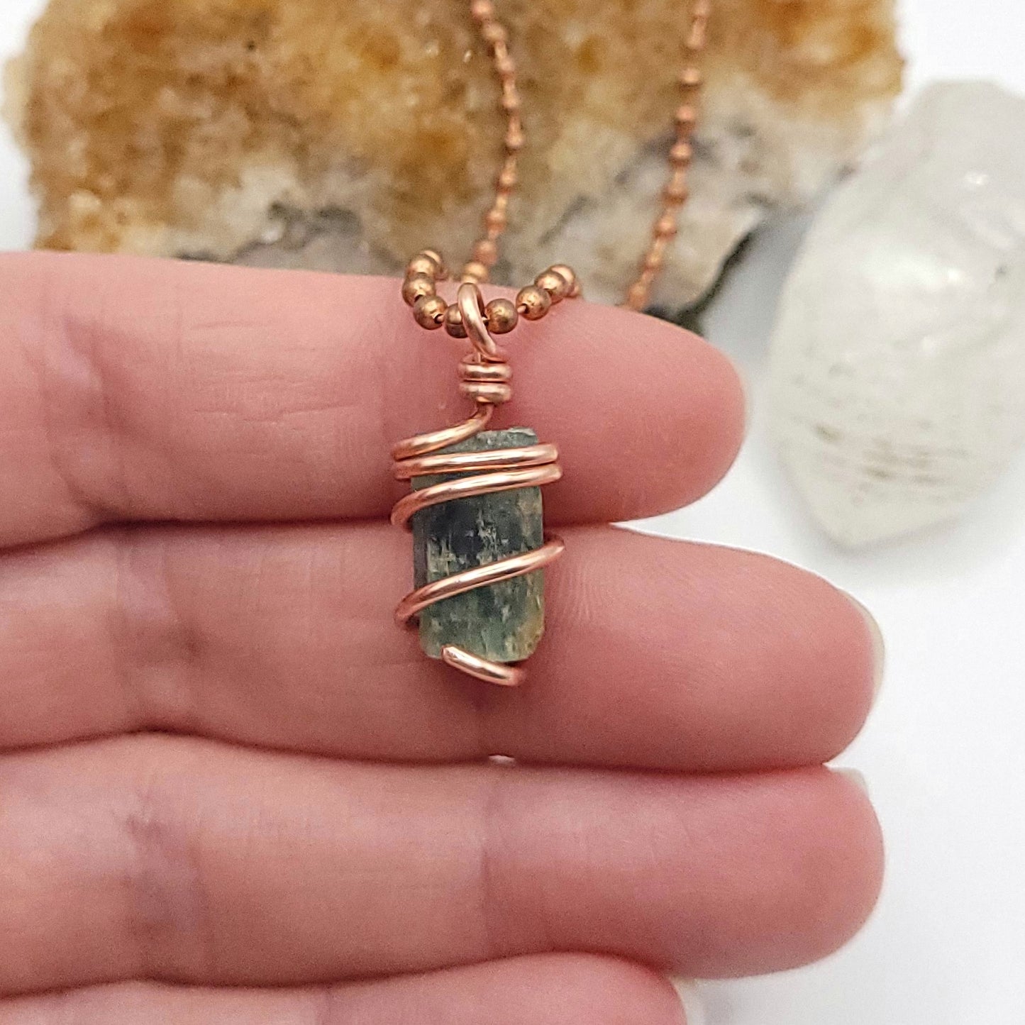 Raw Aquamarine Crystal Necklace in Copper, in hand