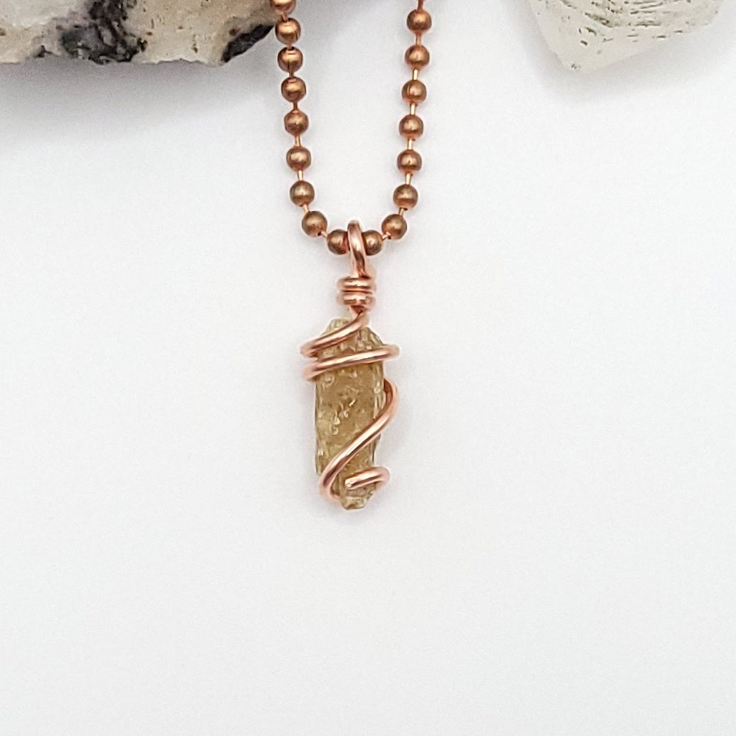 raw yellow kyanite necklace in copper on white backround