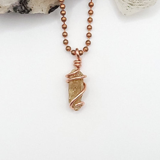 raw yellow kyanite necklace in copper on white backround
