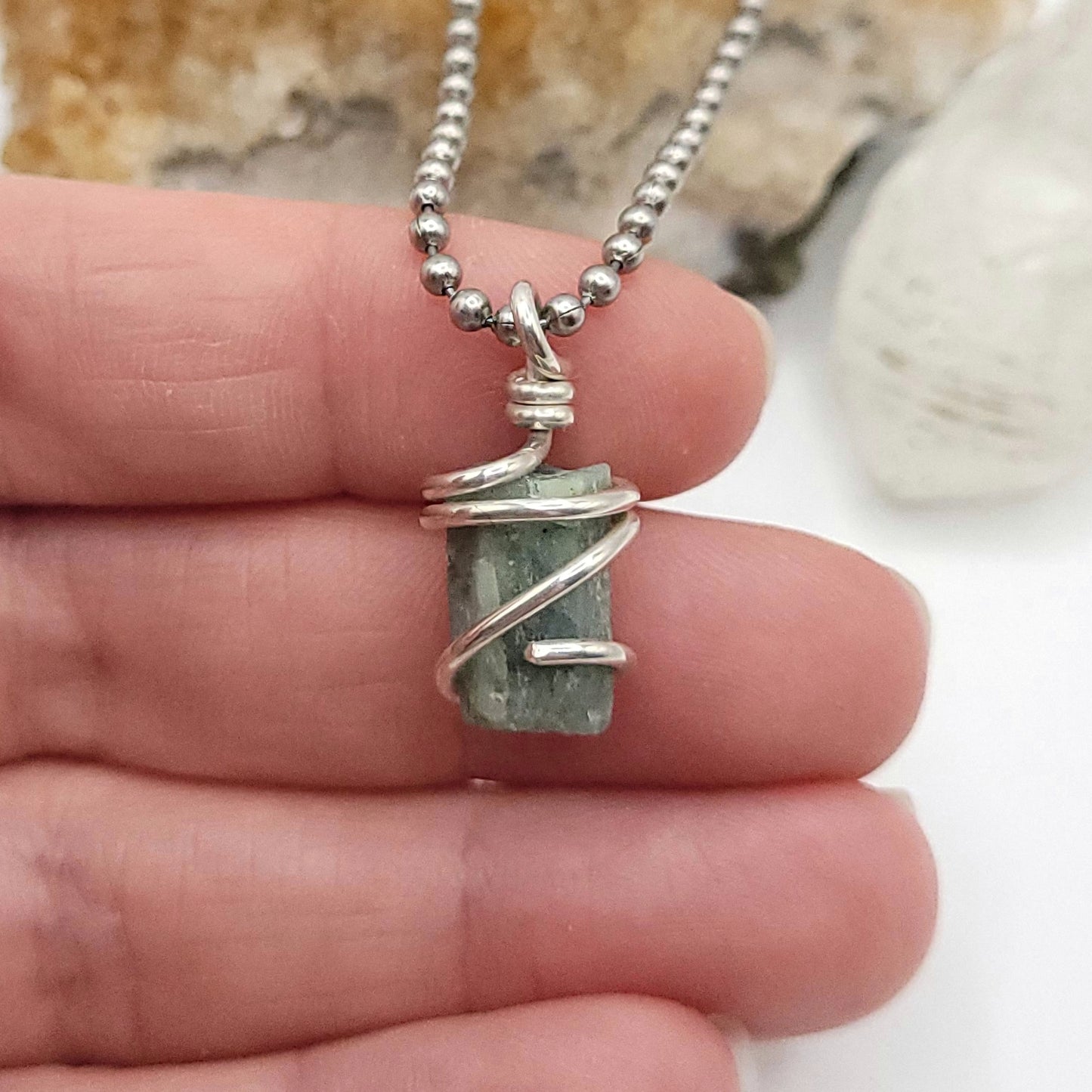 Raw Aquamarine Crystal Necklace in Silver, in hand