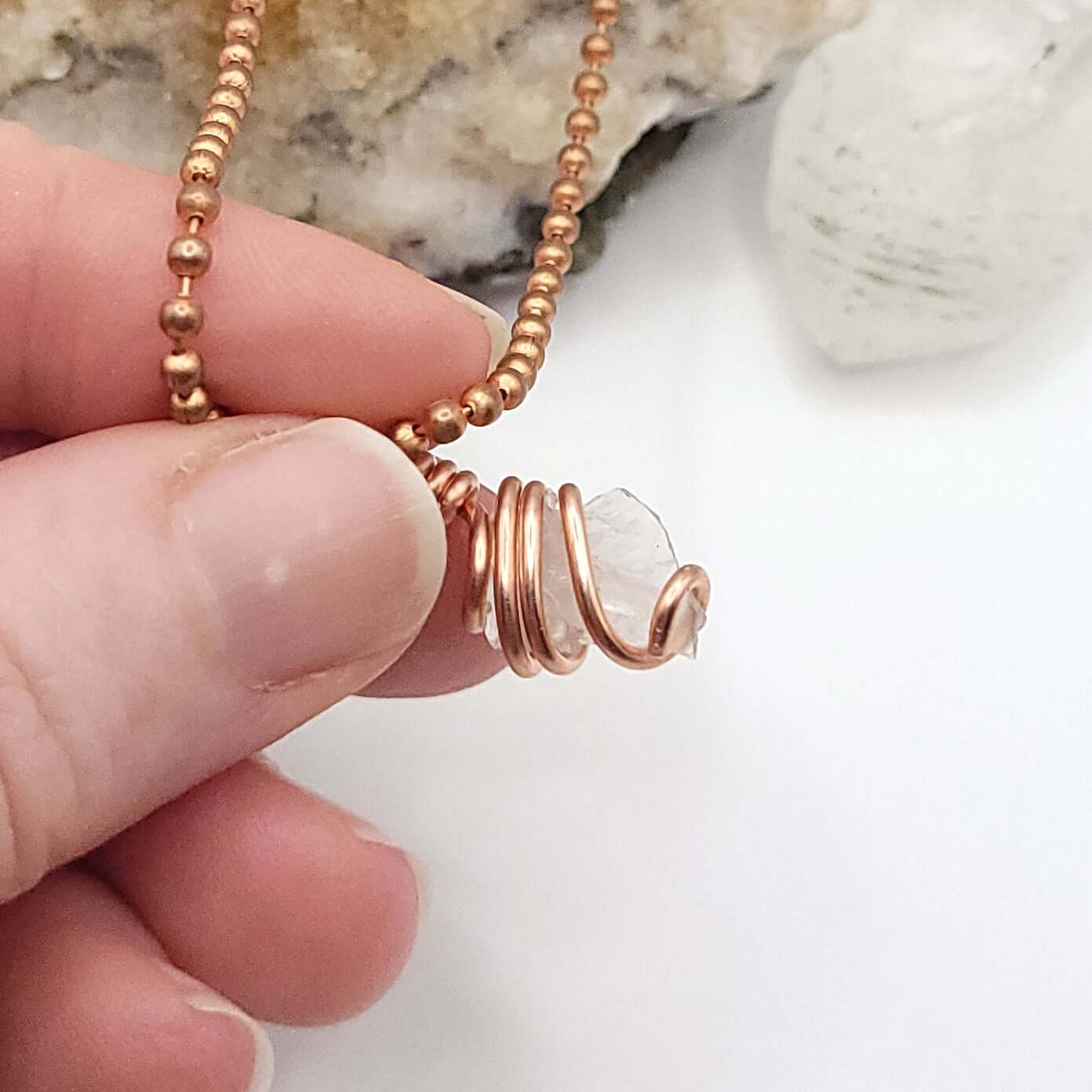 Wire wrapped phenakite in copper