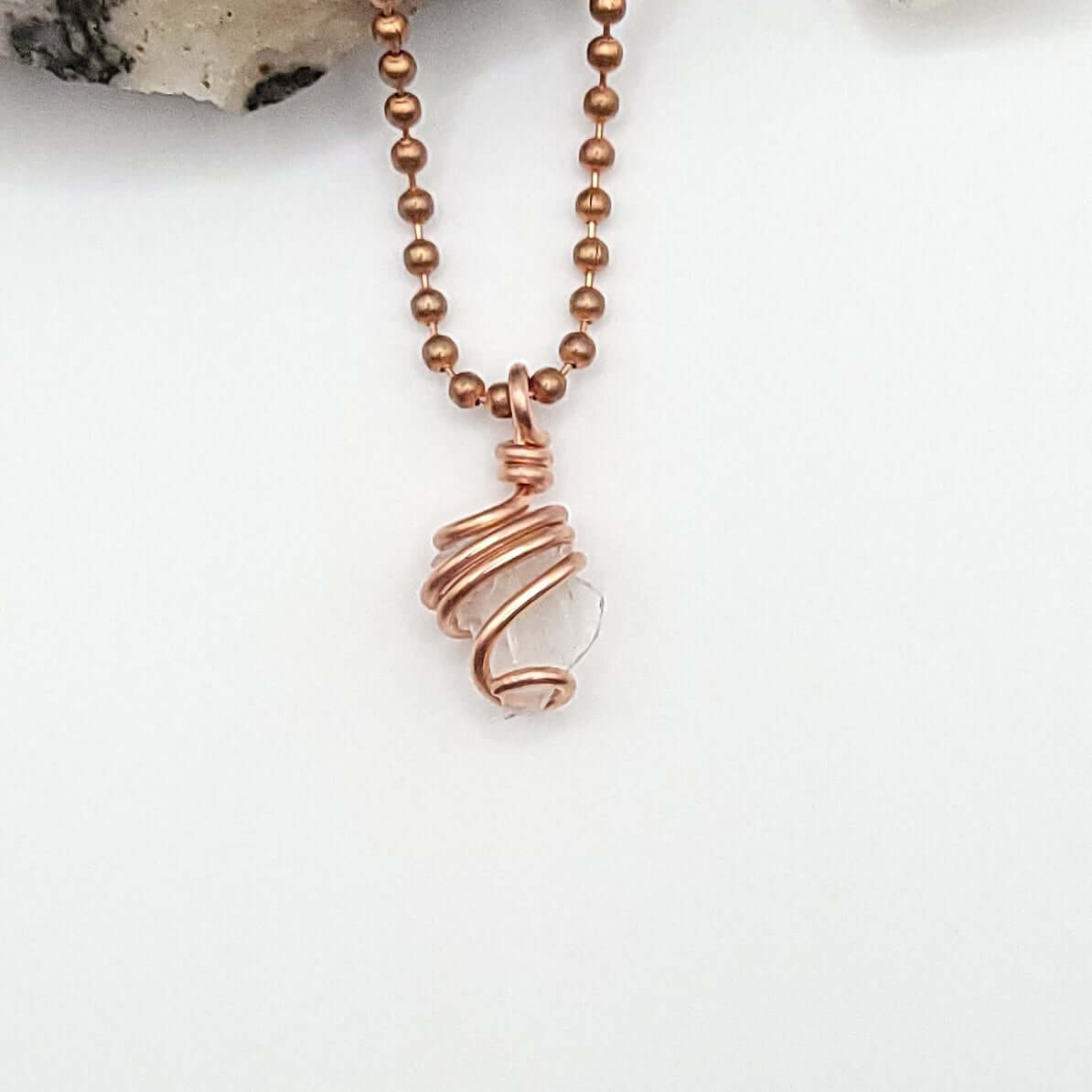 Phenakite necklace on white background
