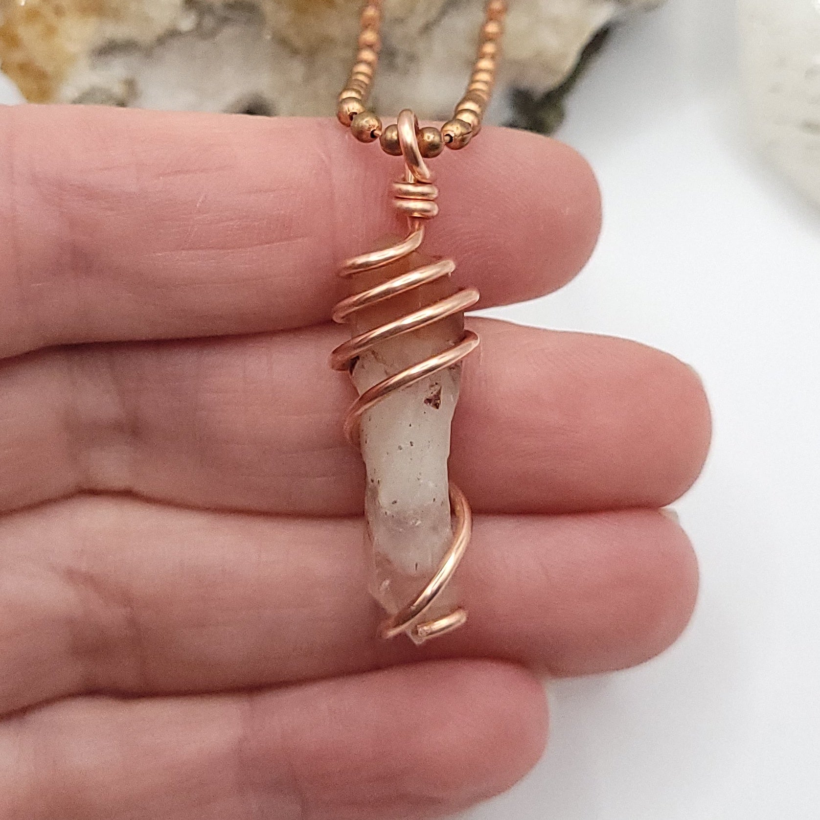 Red Fire Quartz Crystal Necklace in Copper Wire, in hand