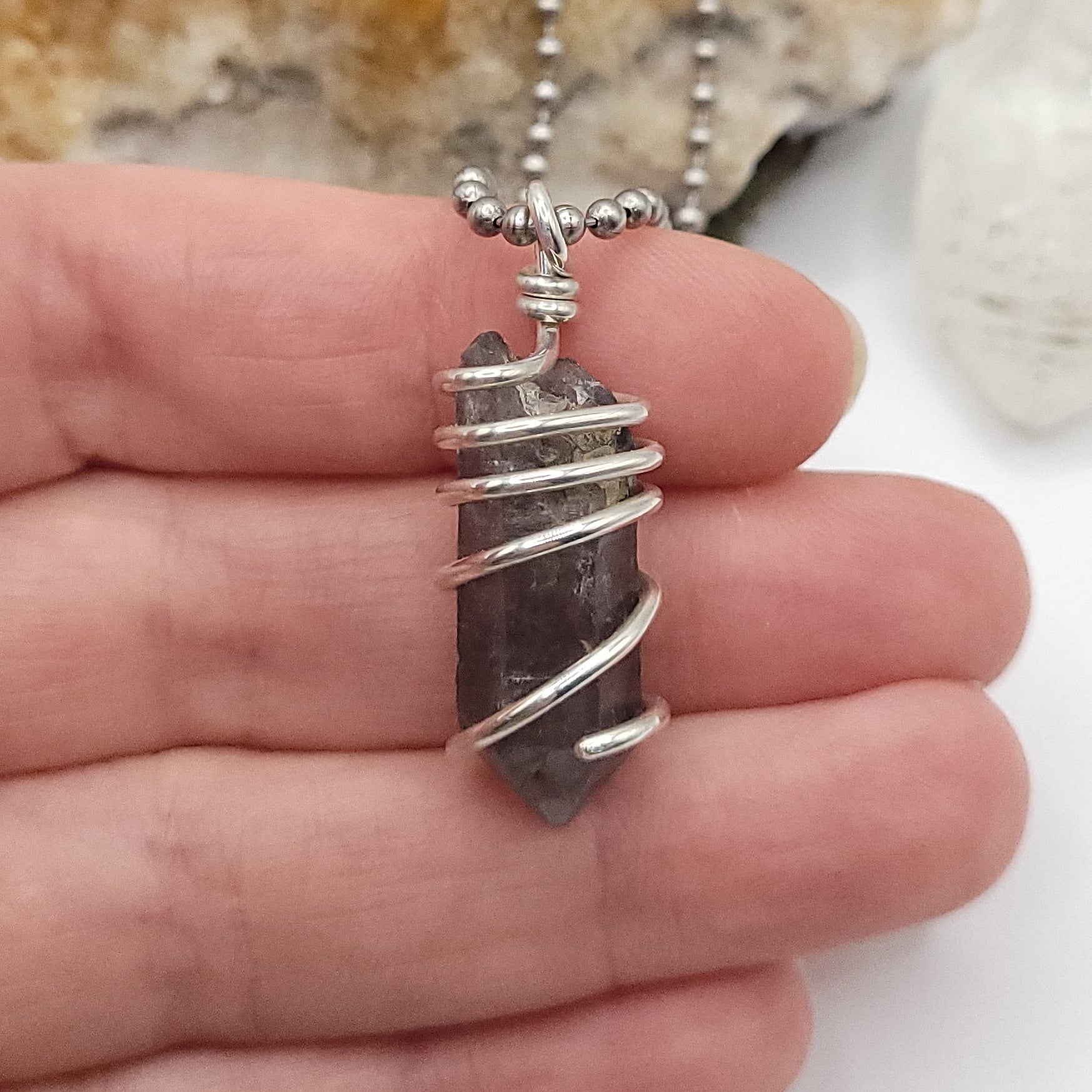 Tibetan Quartz Necklace in Silver, showcasing raw crystal wrapped in sterling silver wire for spiritual clarity.