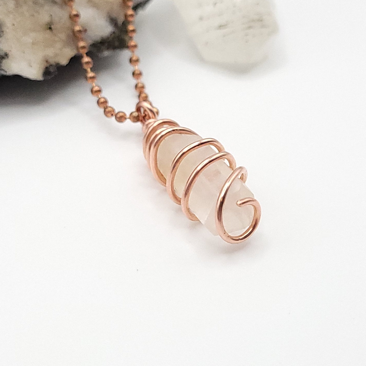 clear quartz necklace in copper side view