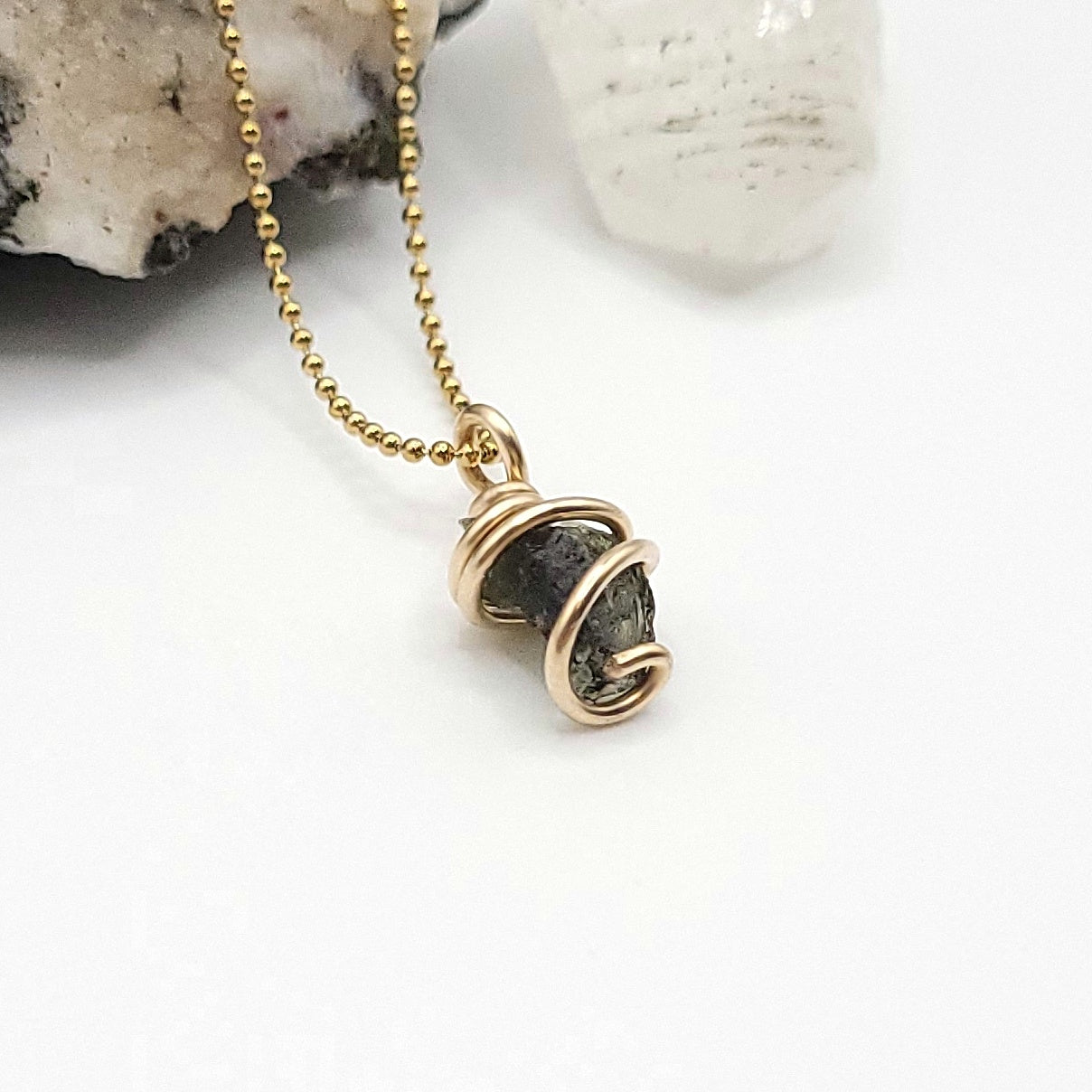 Raw Moldavite Necklace in Gold side view on white background