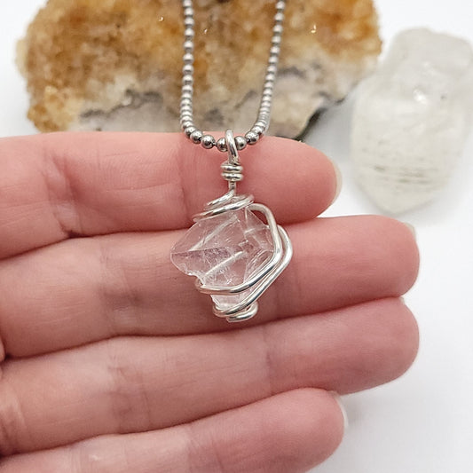 apophyllite necklace in silver wire in hand
