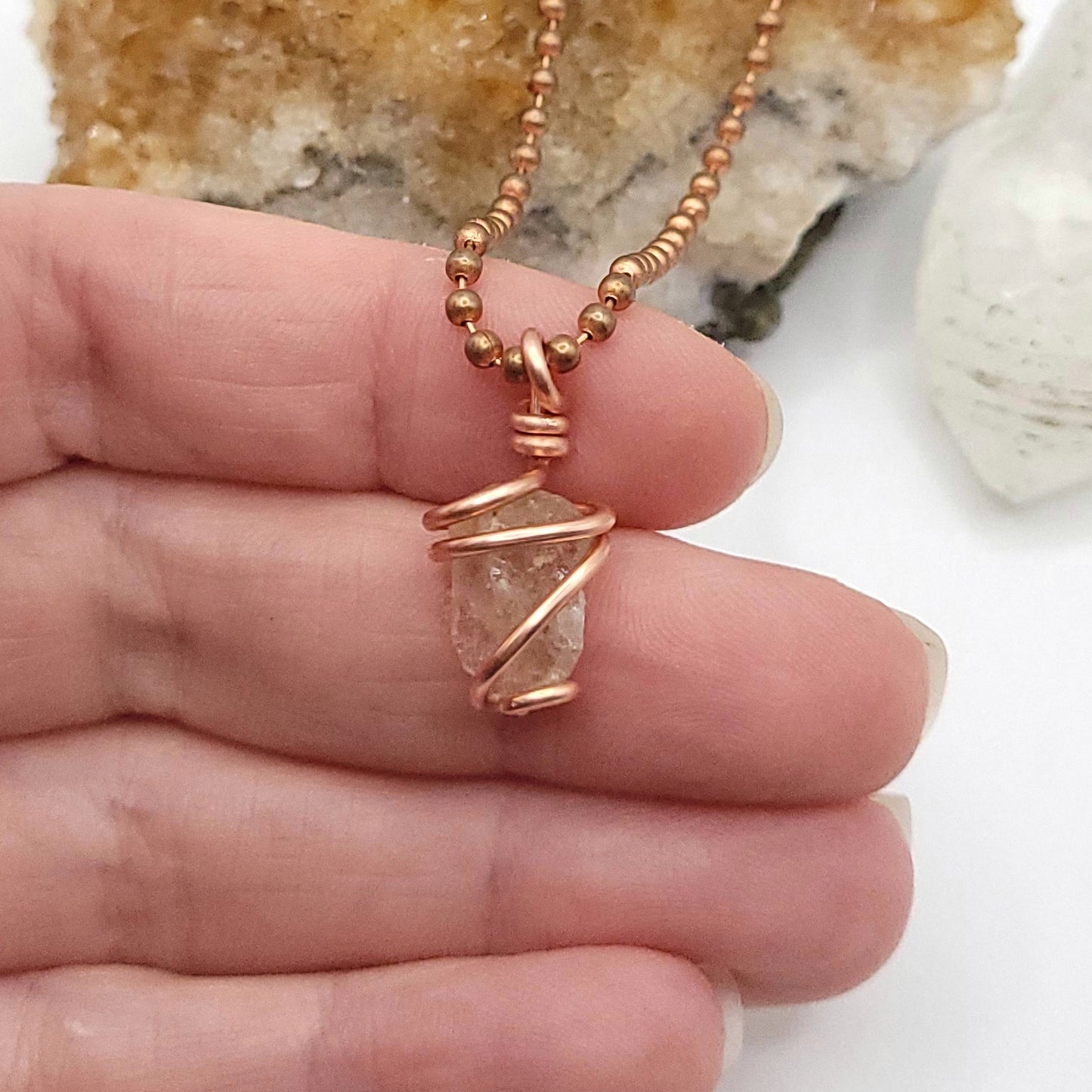 raw citrine necklace in copper in hand