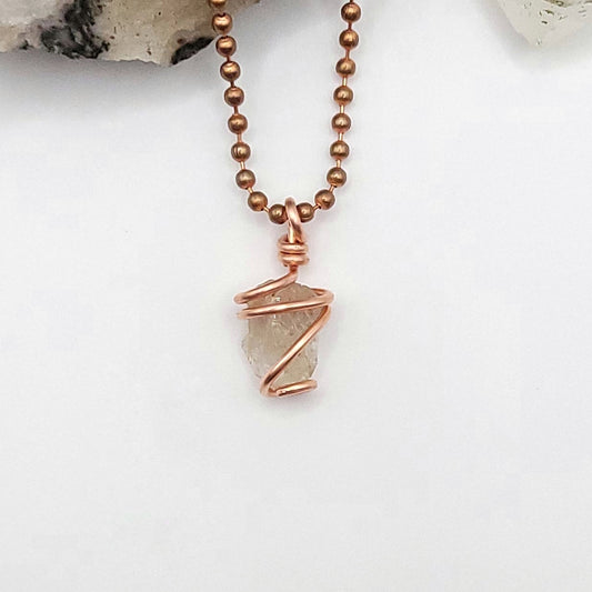 raw citrine necklace in copper on white background