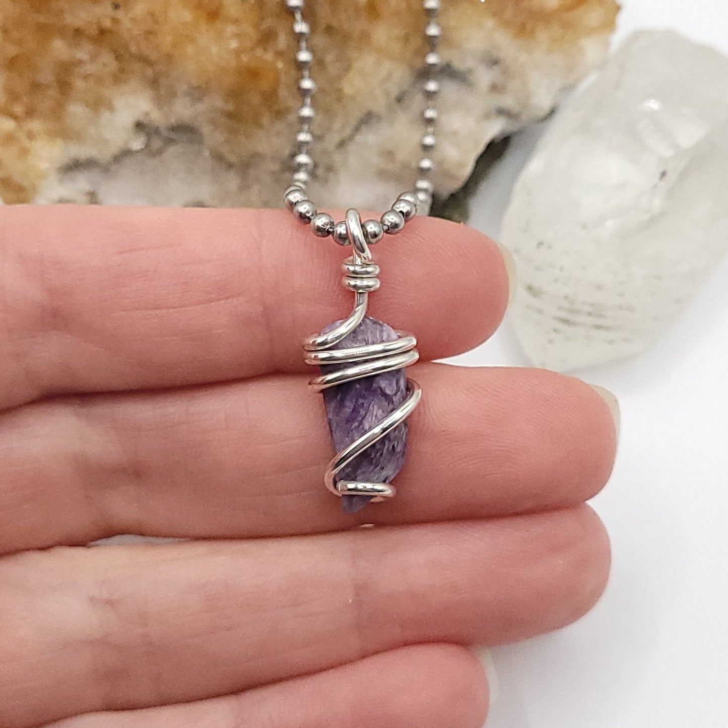 Charoite necklace in silver with a unique wrapped crystal, designed for transformation and positive energy.