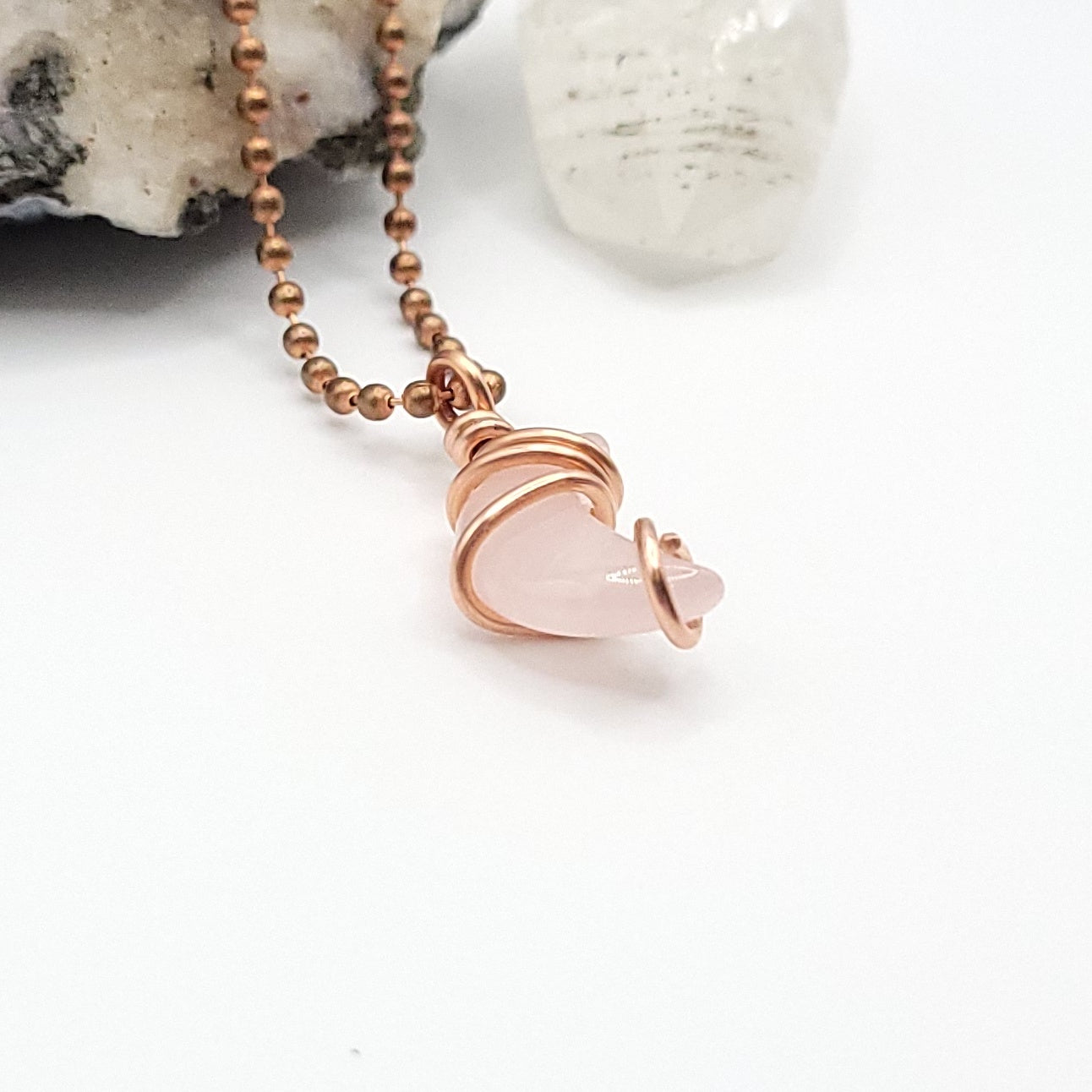 Rose quartz Crescent Moon crystal necklace in copper side view