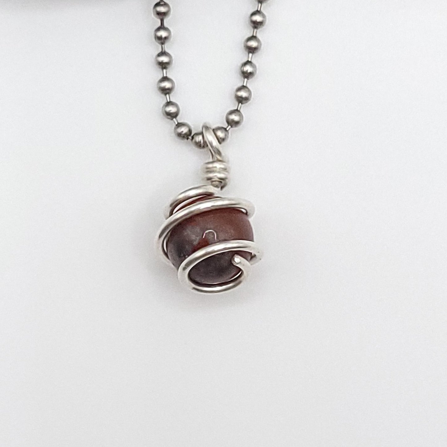 African Bloodstone Sphere Crystal Necklace in Silver on white background