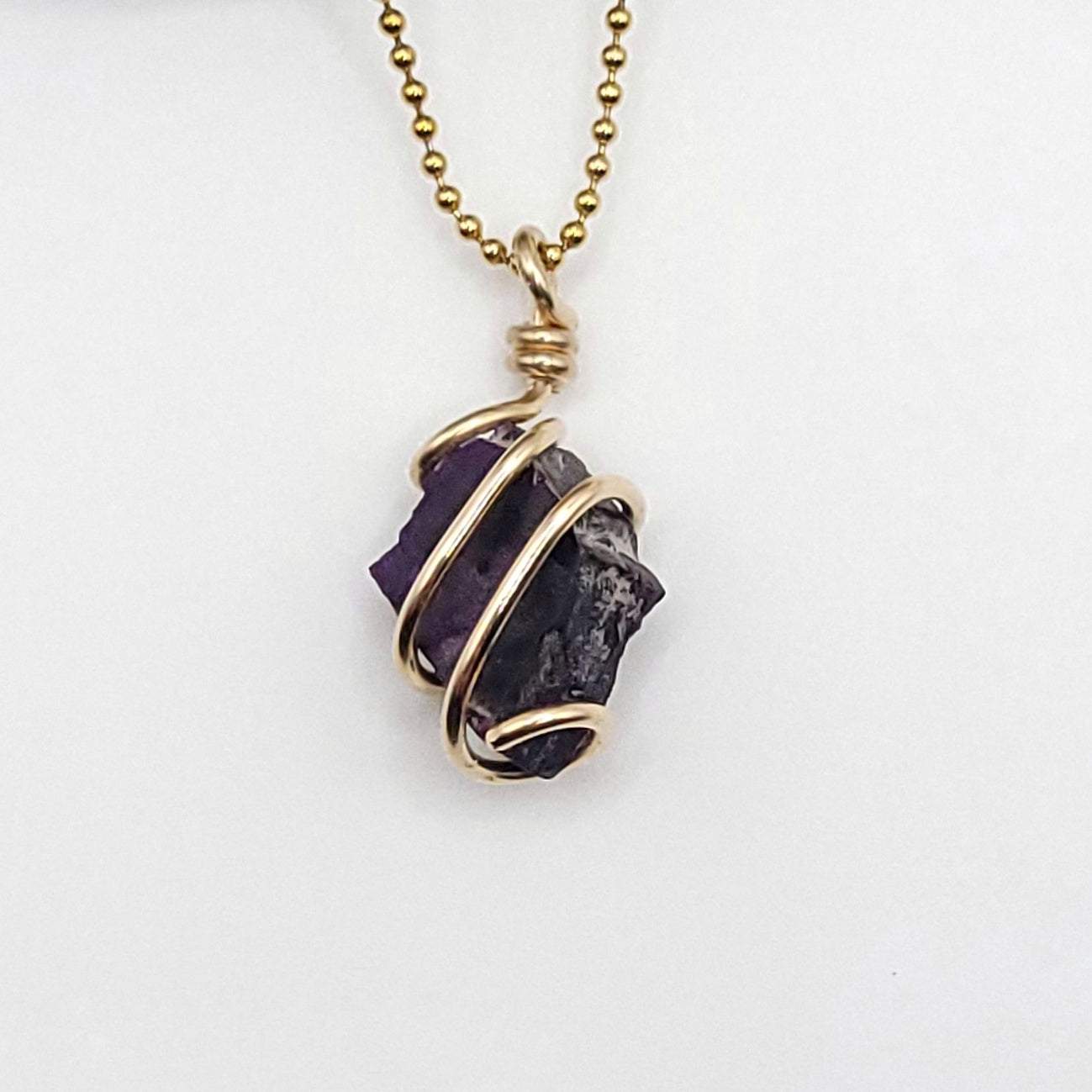 Raw Sugilite Crystal Necklace in Gold close up