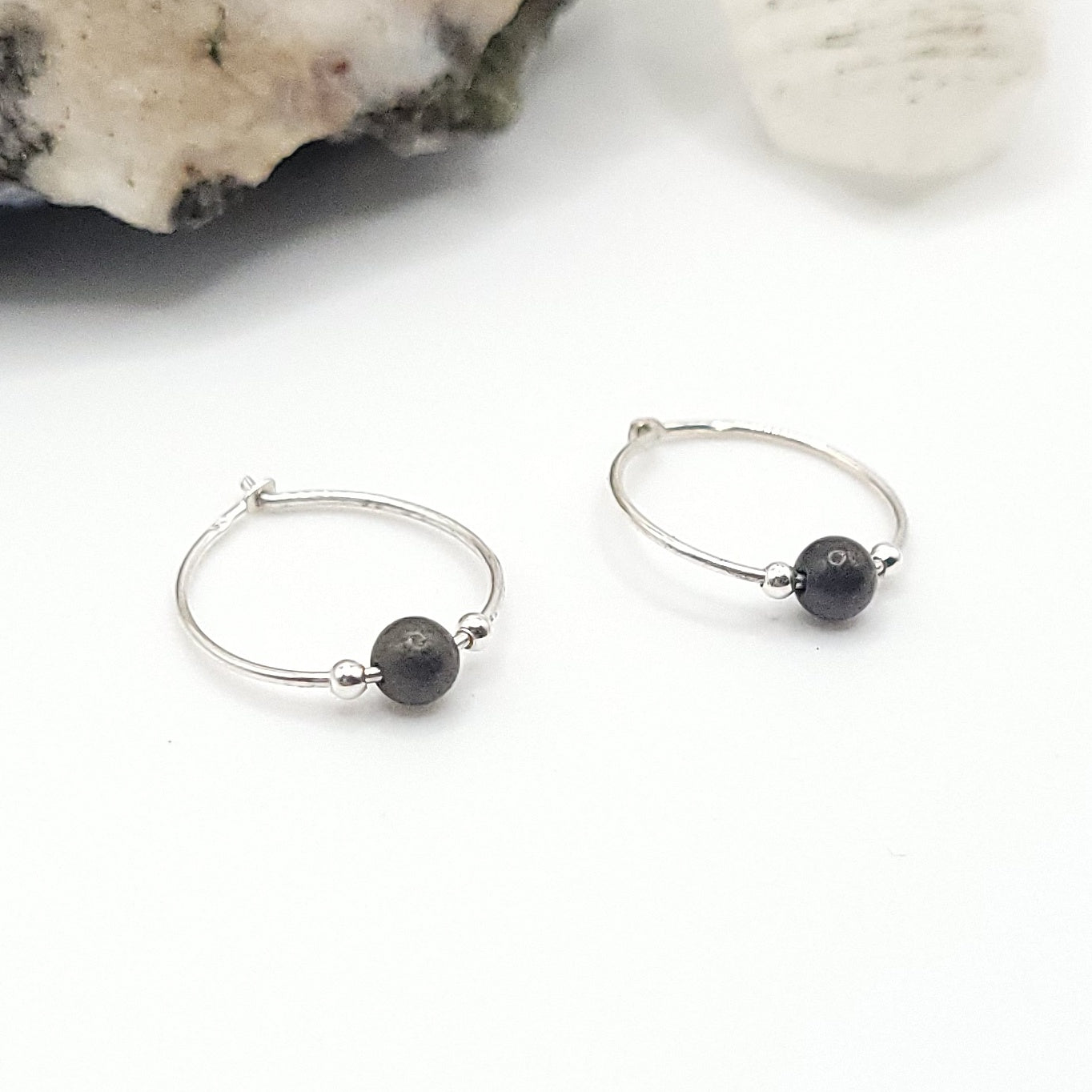 side view of silver and pyrite hoops earrings