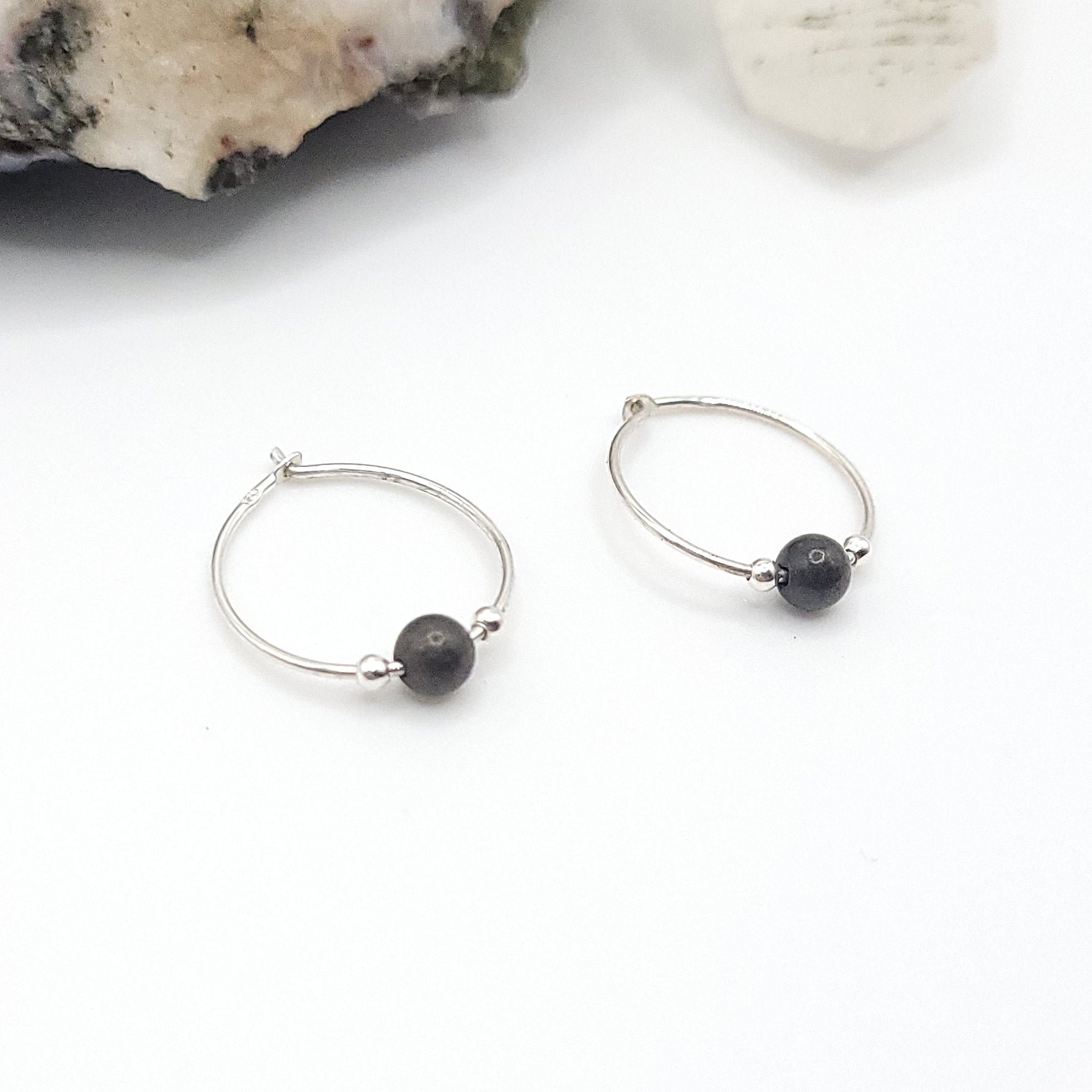 silver and pyrite hoops earrings on white background