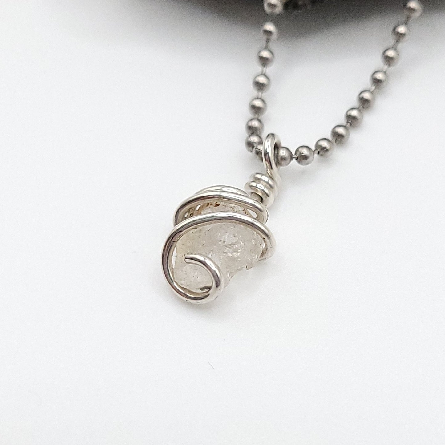 raw phenakite necklace in silver side view