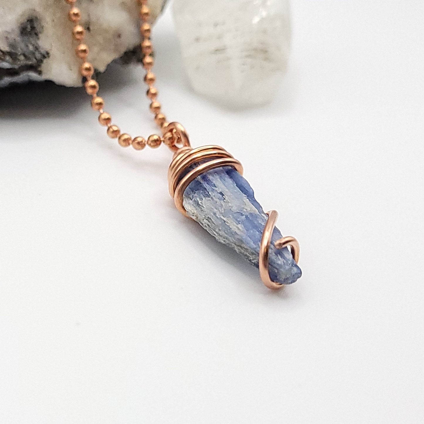raw blue kyanite necklace in copper on white background side view