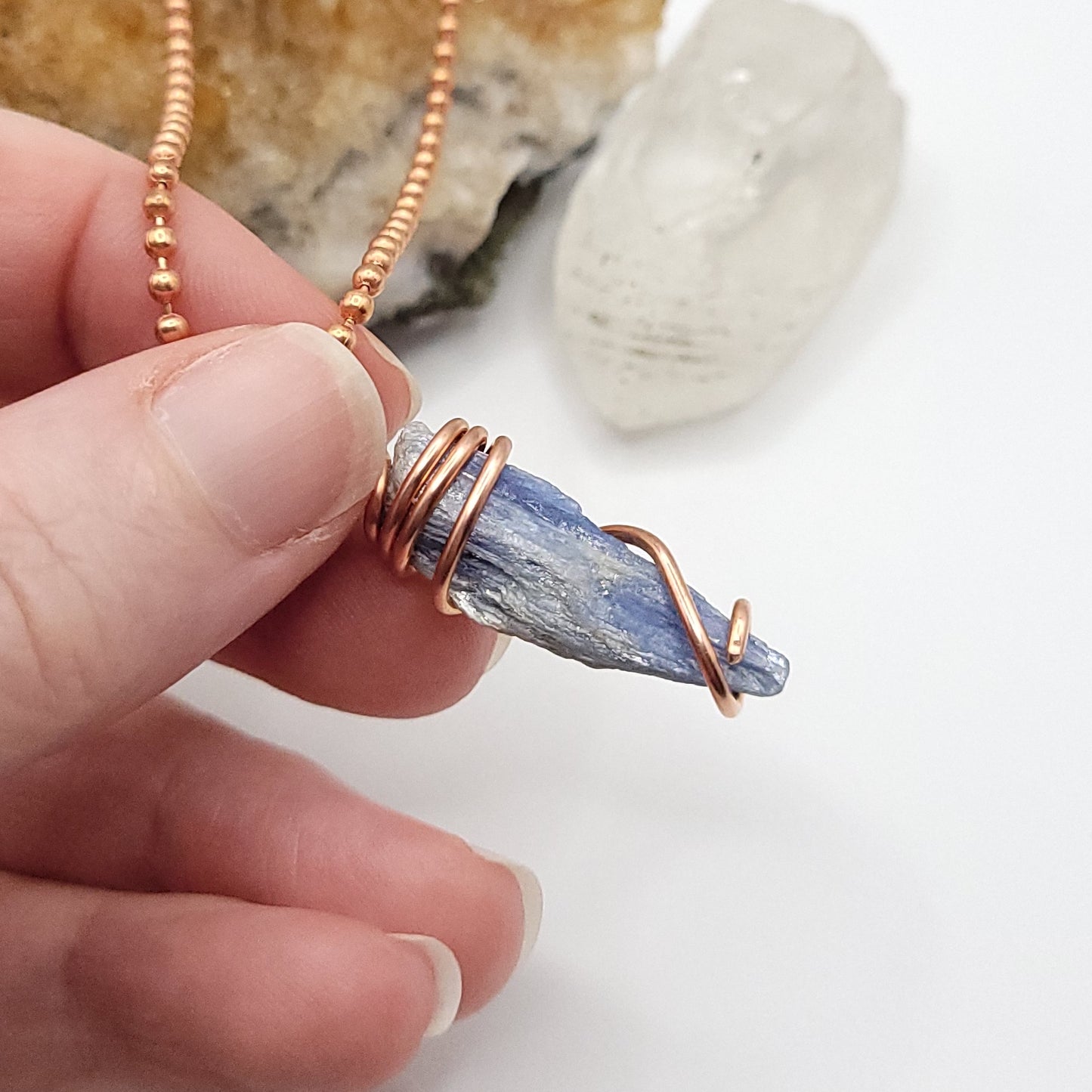 raw blue kyanite necklace in copper side view