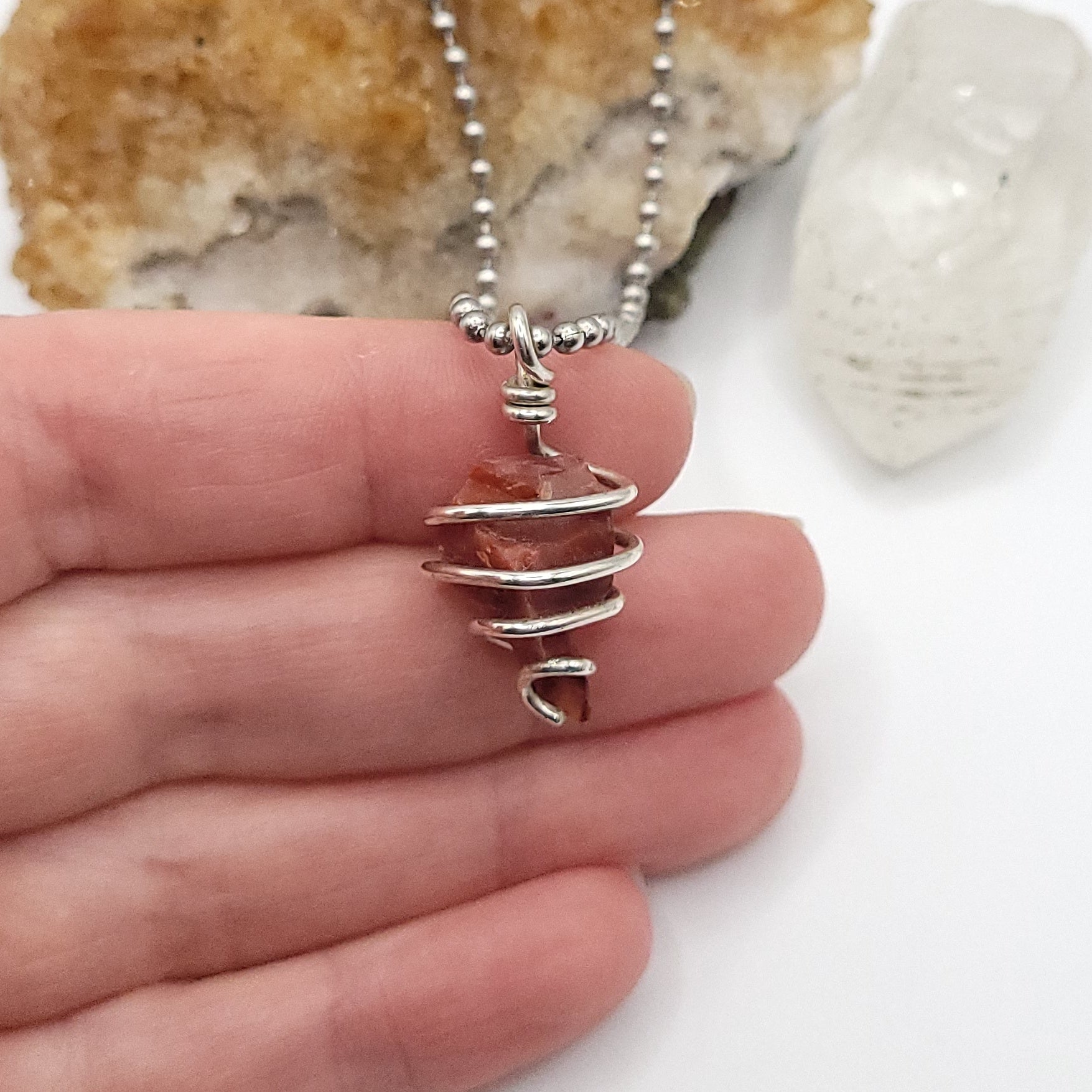 carnelian necklace in silver in hand