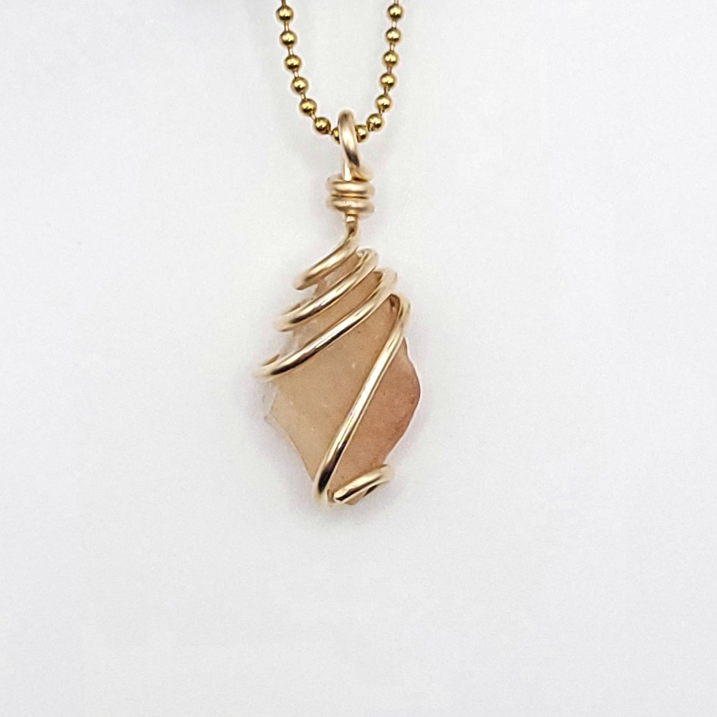 Raw Libyan Desert Glass Crystal Necklace in Gold up close on white background