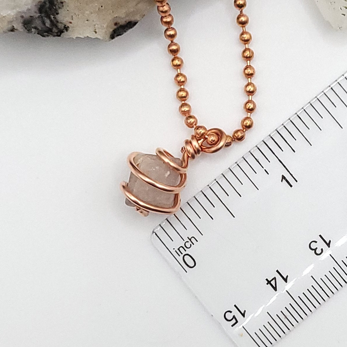 Genuine Beta Quartz necklace wrapped in copper, showcasing its unique design and connection to transformation.