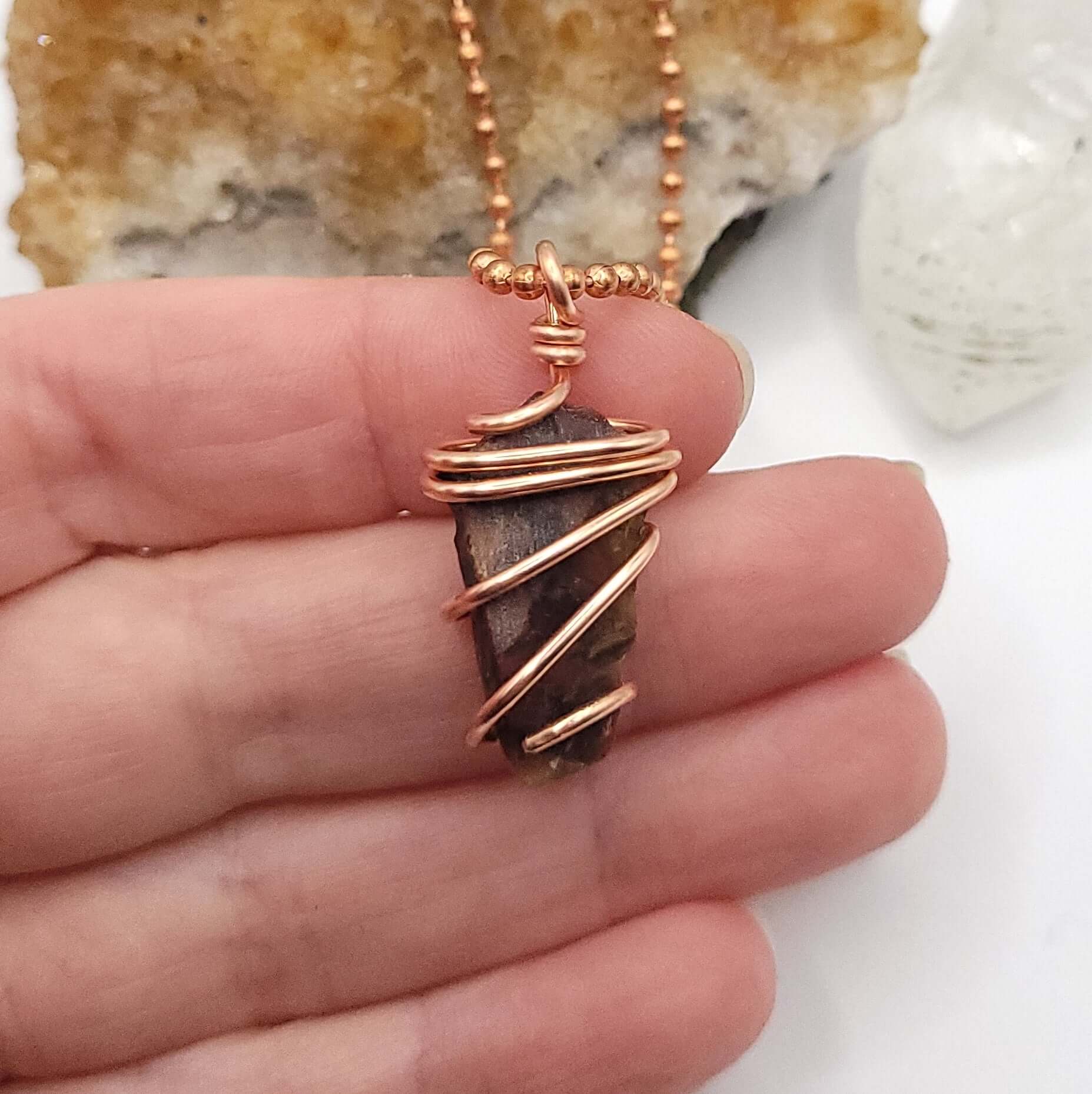 Raw Pietersite necklace in Copper in hand