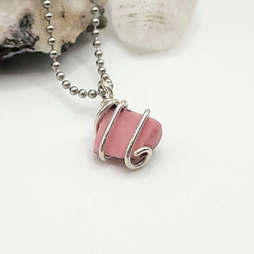 rhodonite necklace in silver side view on white background
