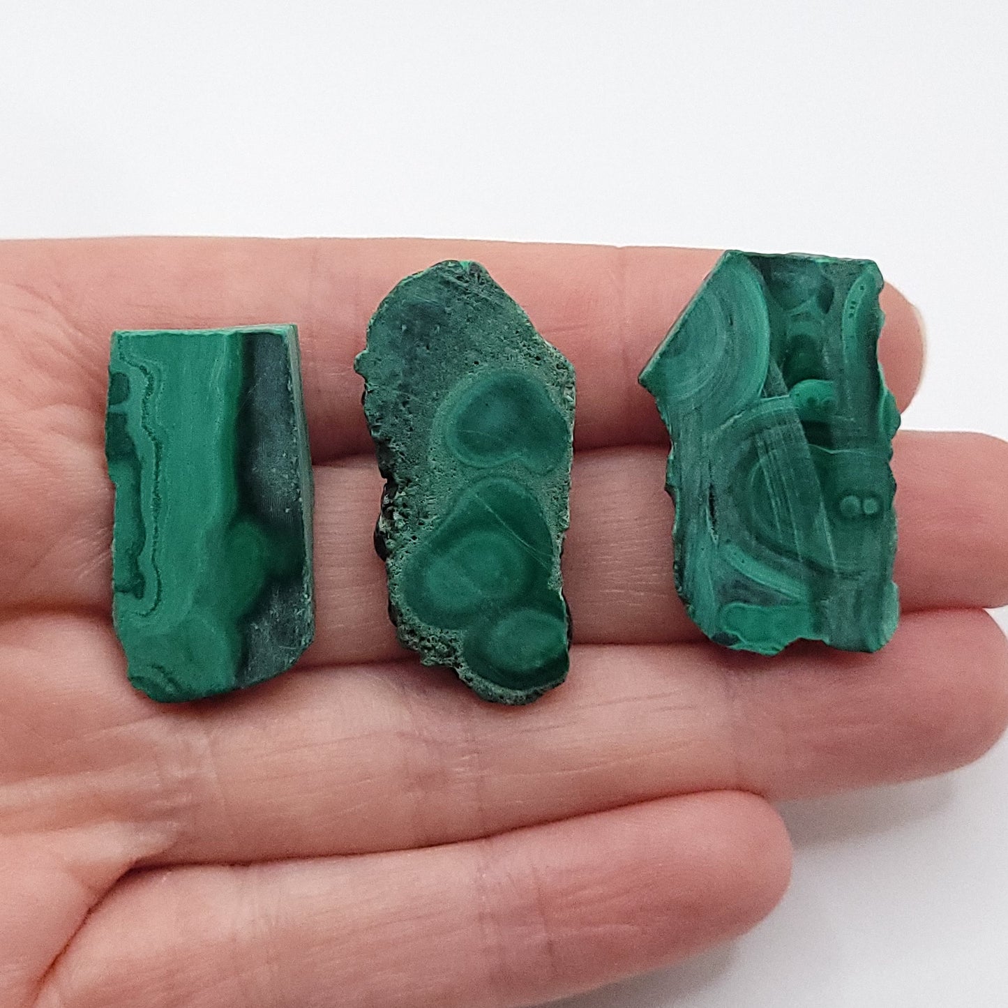 raw malachite necklace stone choices in hand
