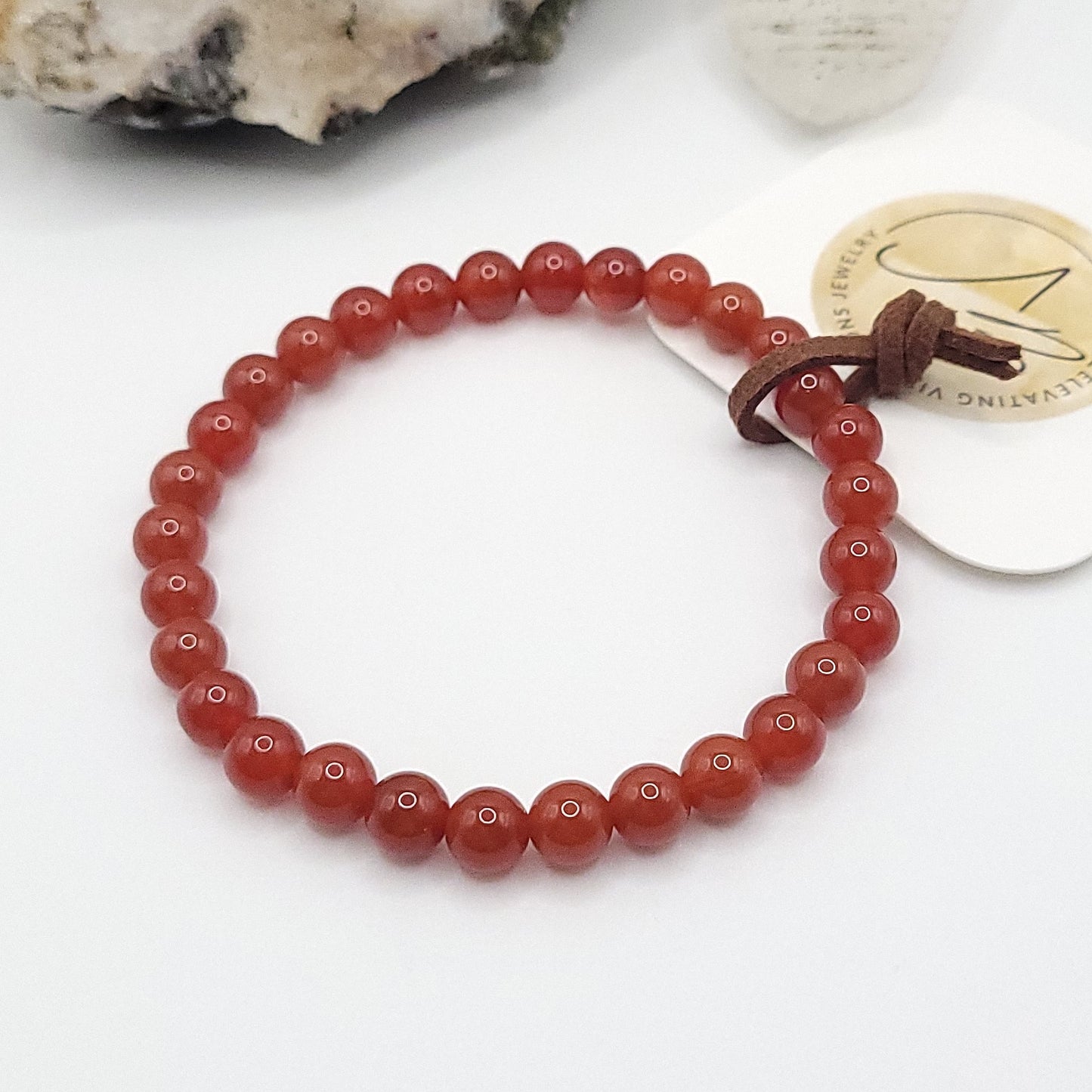 carnelian bracelet, 7" beaded stretch bracelet on white background