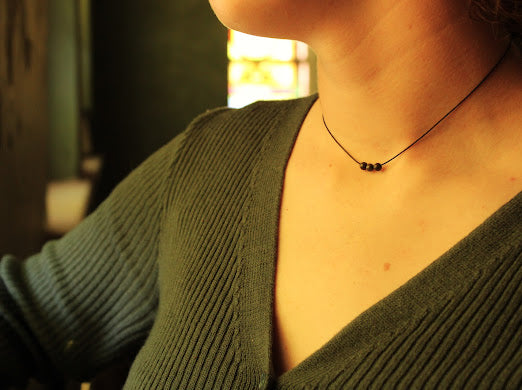 model wearing adjustable garnet necklace