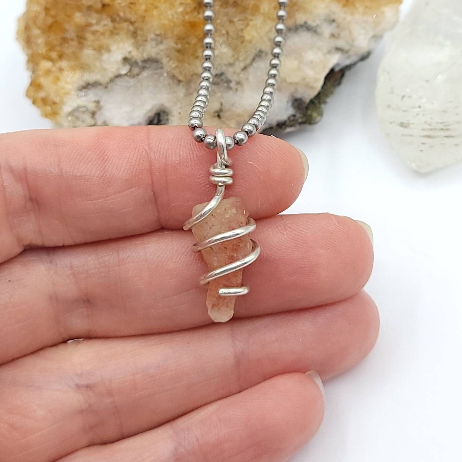Sunstone Necklace, Silver Wire Wrapped Sunstone Pendant in hand