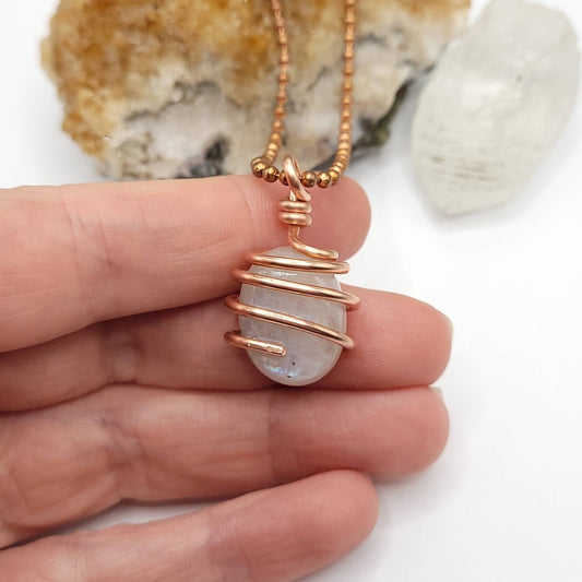 Rainbow Moonstone Necklace, Copper Wire Wrapped Moonstone Pendant in hand