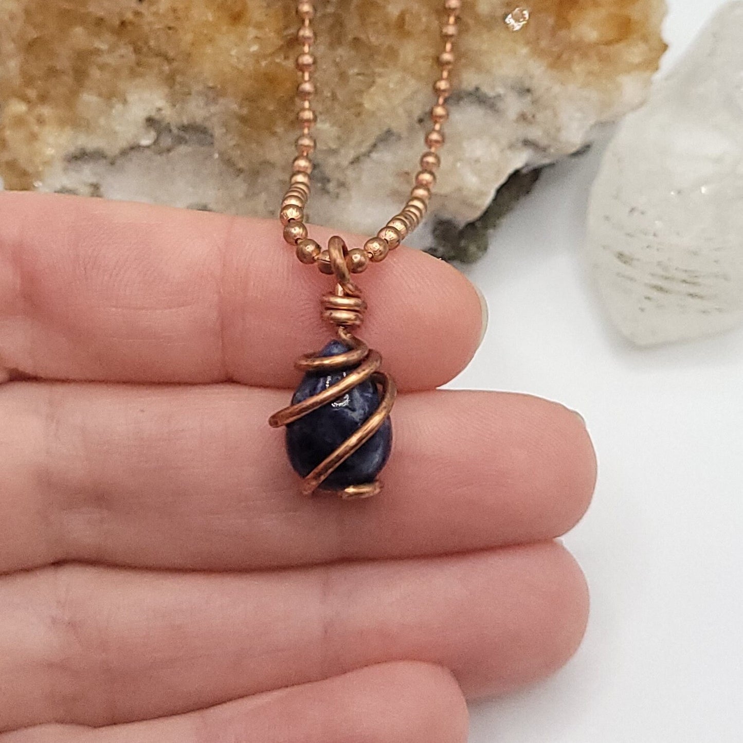 Sodalite Crystal Teardrop Necklace in Copper Wire in hand