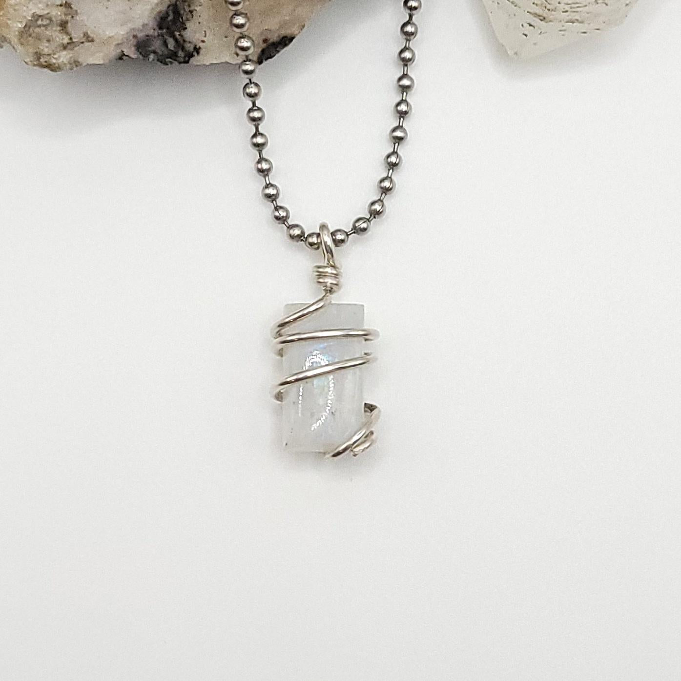Rainbow Moonstone Crystal Necklace in Silver, rectangle shaped stone on white background