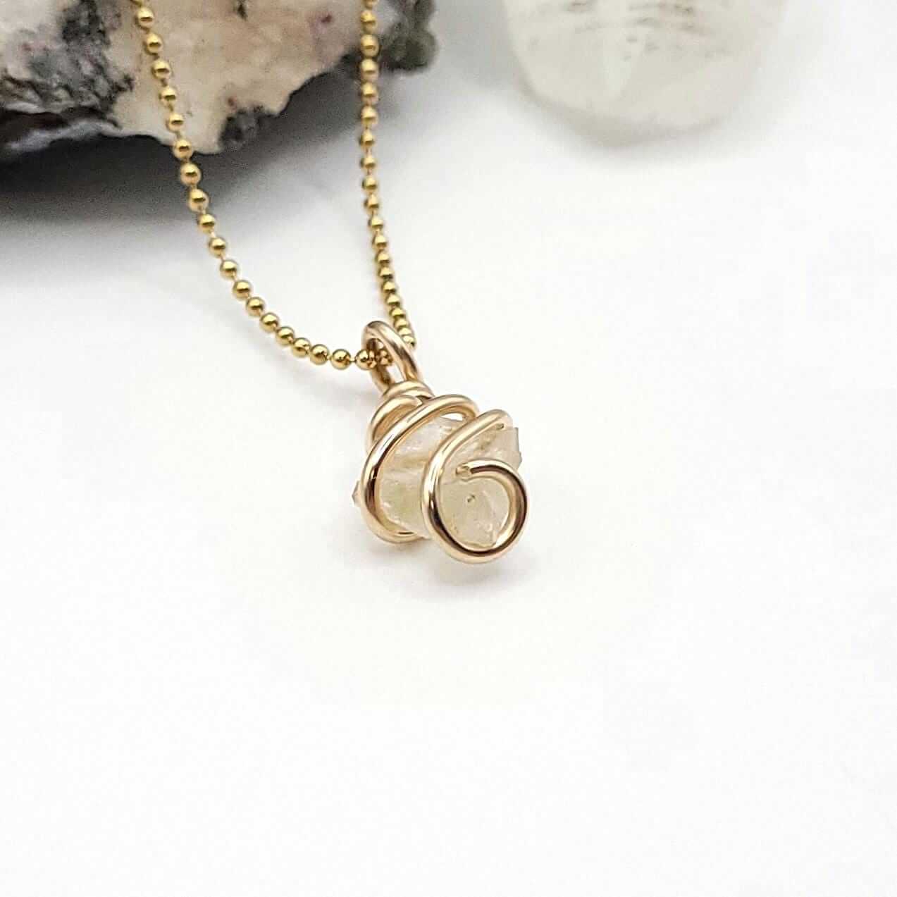 Raw Libyan Desert Glass Crystal Necklace in Gold, side view on white background