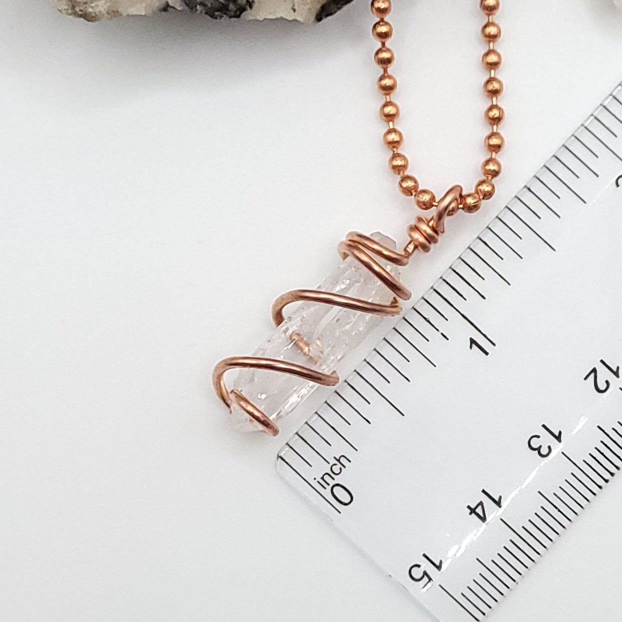 raw danburite pendant in copper measurement just under 1.5"