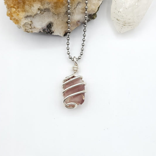 lithium quartz necklace in sterling silver wire on white background